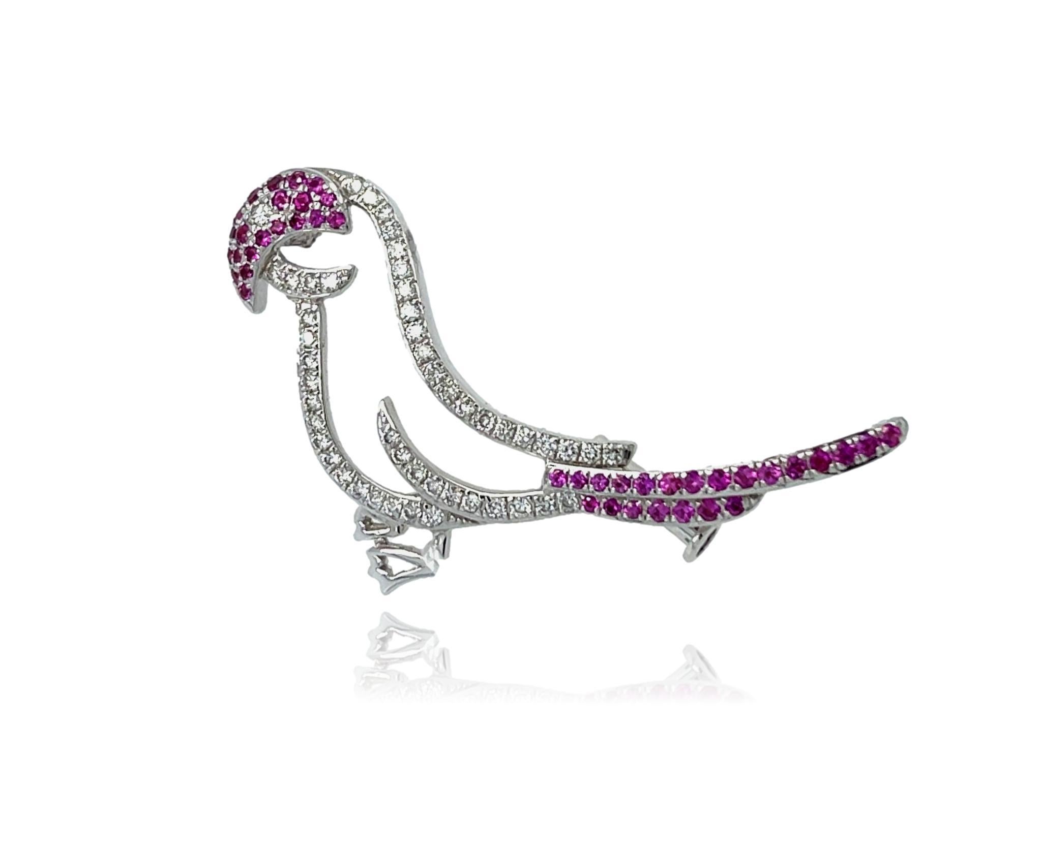This stunning Bird Brooch is the perfect accent to wear at that cocktail event. It has sparkling diamonds and beautiful top quality Pink Sapphires all set in 18K white gold. It has a pull lock for extra security. This brooch comes in a beautiful box