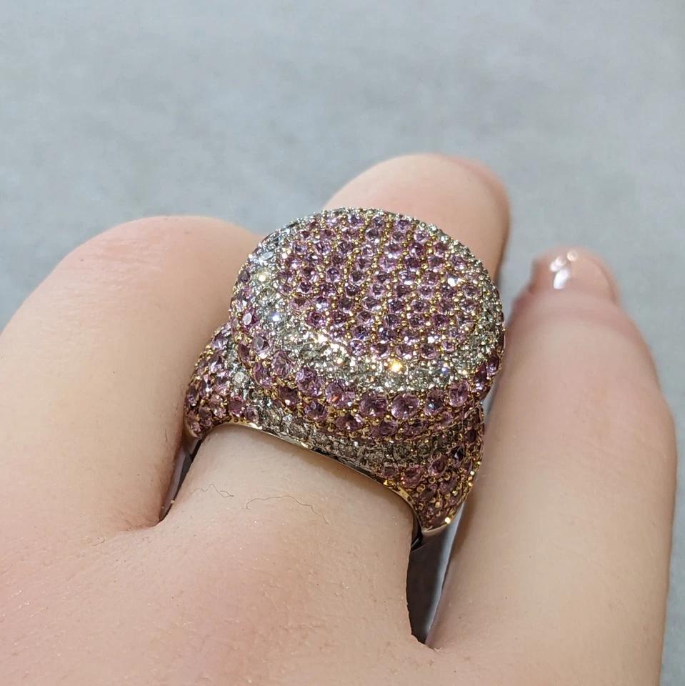 Pave Natural Pink Sapphire and Diamond Dome Ring in 18k White and Yellow Gold

Pave Natural Pink Sapphire and Diamond Dome Ring features 6.35 carats of Round Brilliant Pink Sapphires and Round Brilliant Diamonds pave set in a flat dome style with