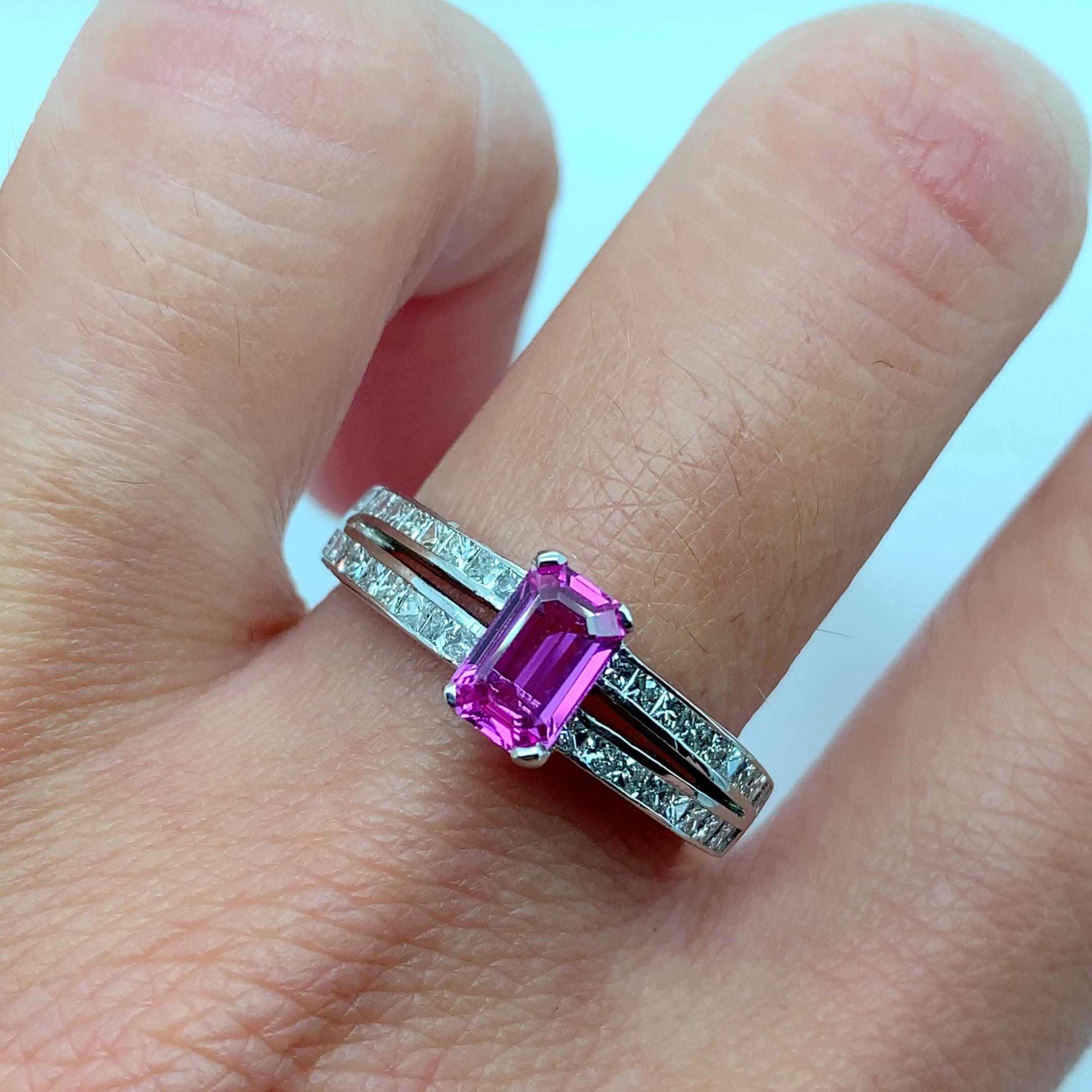 
This stunning 18ct white gold ring boasts a 1.50ct natural pink sapphire as its main stone, complemented by sparkling diamonds and a beautiful emerald cut. Perfect for any special occasion, especially engagements, this pink sapphire diamond ring is