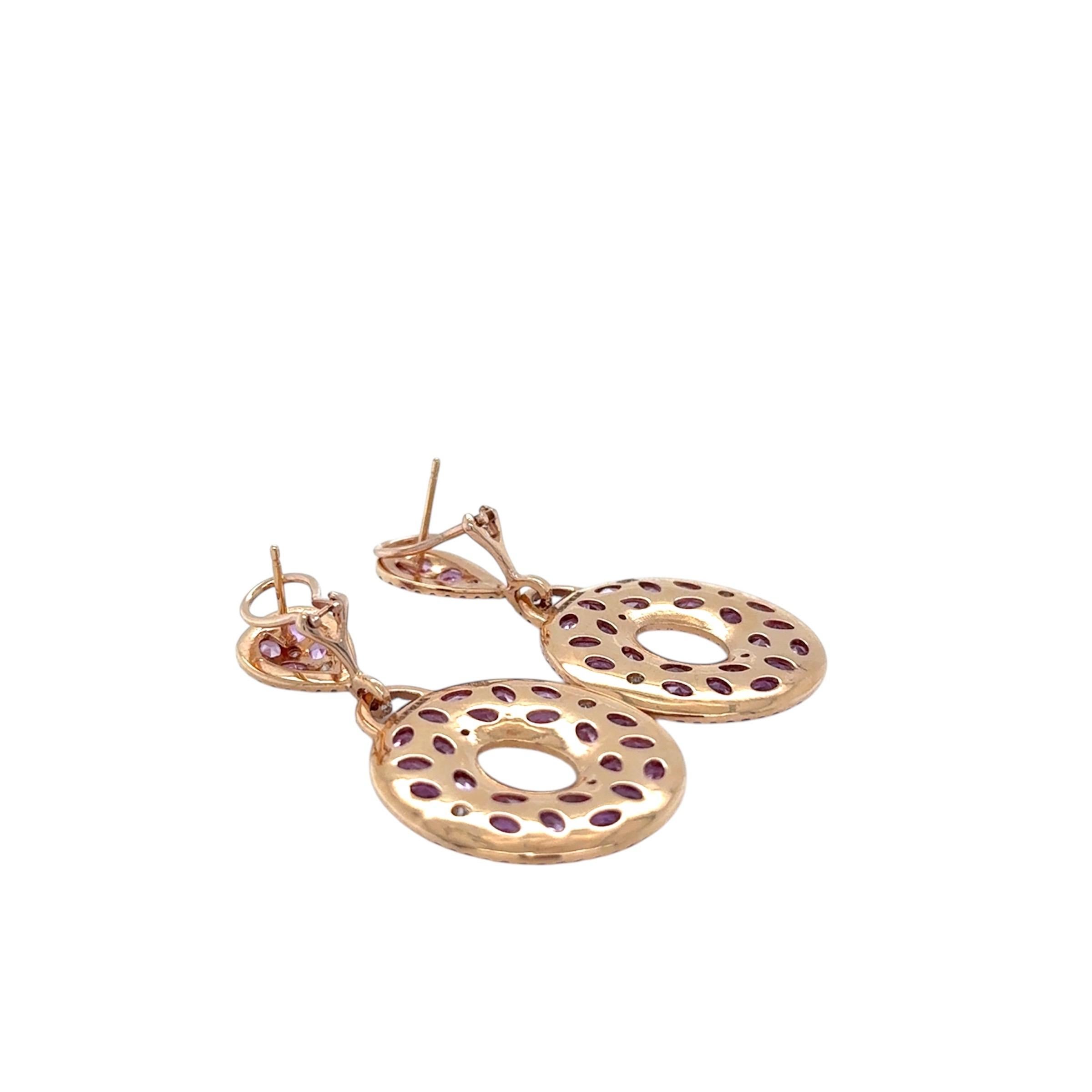 These gorgeous drop earrings feature rose cute and round brilliant cut pink sapphires weighing approximately 10.00 carats total and numerous round brilliant cut diamonds weighing approximately 2.00 carats total. Crafted out of 18 karat rose gold,