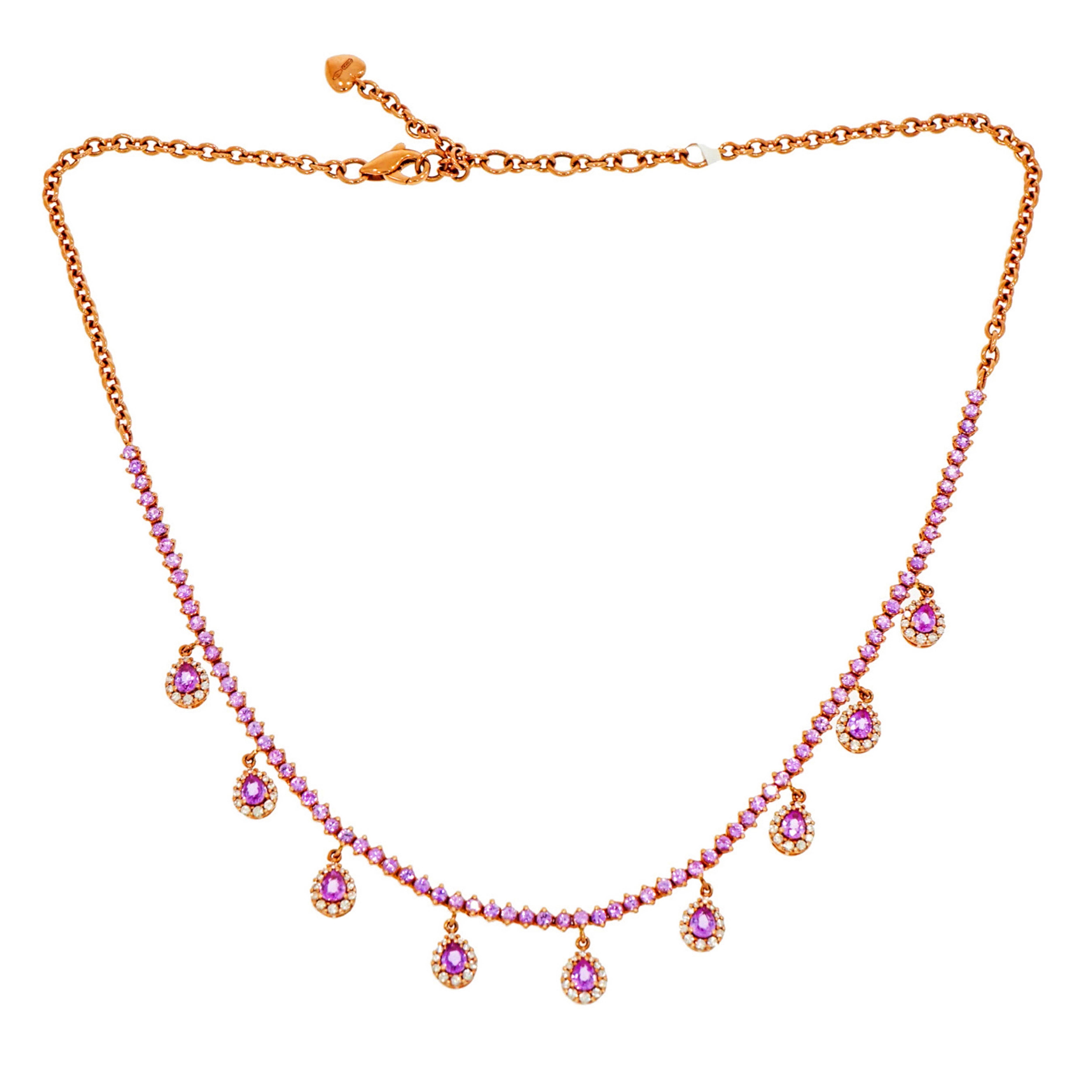 This enchanting Pink Sapphire and Diamond Necklace, is designed and perfectly crafted by Leo Pizzo in 18k Rose Gold.
Set with a line of round Pink Sapphires and accented by Pear shaped Pink Sapphire Drops surrounded by  a halo of White Diamonds.
