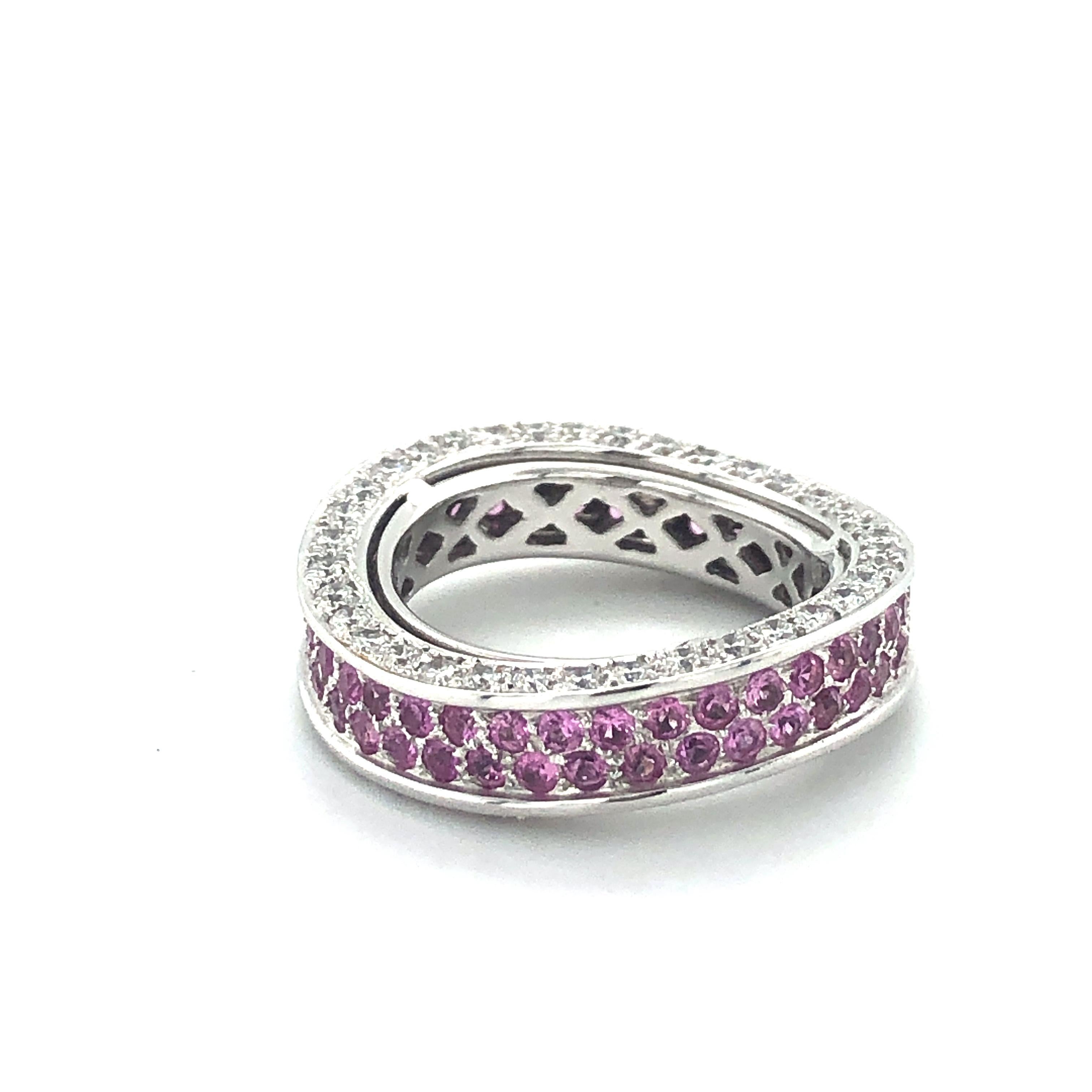 This wave-shaped White Gold ring is set in 2 rows with 76 pink sapphires totaling 1.84 ct. On the side, 73 brilliant-cut diamonds totaling 1.39 ct (Quality: H/si) shine.

Size: 53 / US 6.5

Maker's mark: HPB
Assay mark: 750