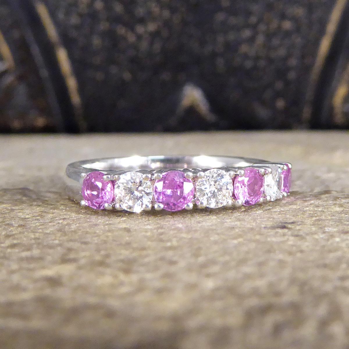 A colour twist on the classic eternity band. This ring features four Pink Sapphires alternating with clear and bright Brilliant Cut Diamonds spanning the head of the finger allowing the stones to sparkle from all angles. There is a total of 0.48ct