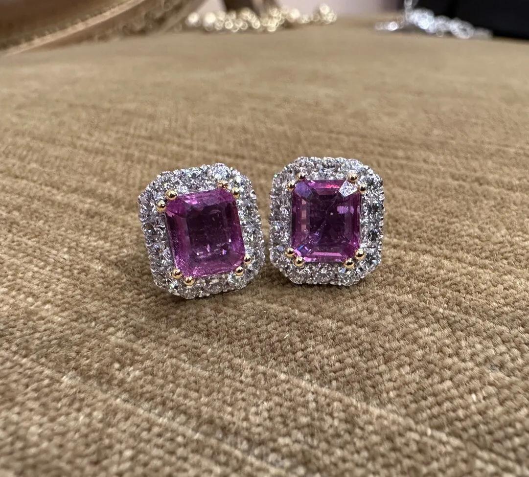 Pink Sapphire and Diamond Halo Earrings in 18k White Gold

Diamond and Pink Sapphire Earrings feature Emerald cut Pink Sapphire center stones surrounded by a Halo of Round Brilliant Diamonds set in 18k White Gold.

Total pink sapphire weight is 3.00