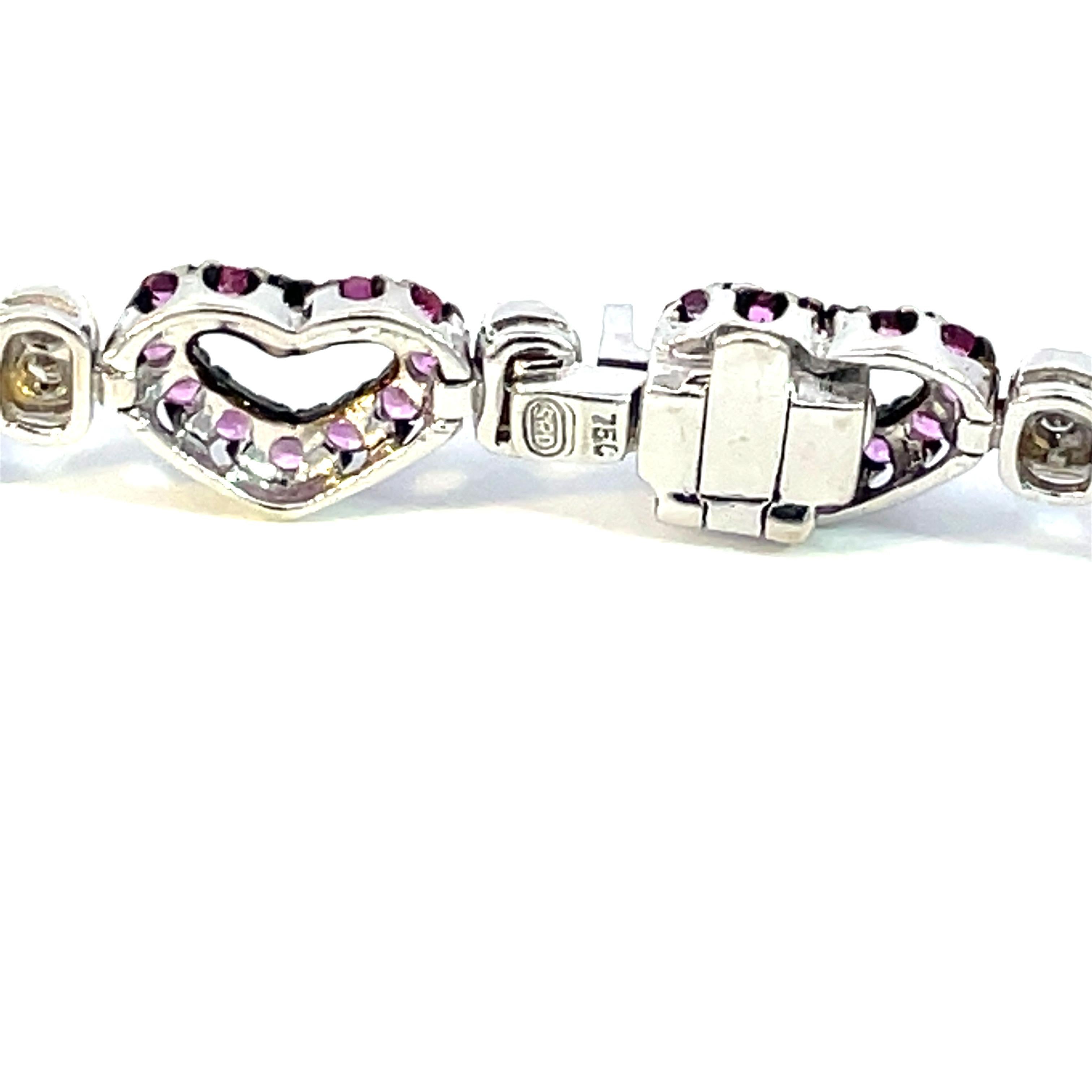 One 18kt white gold hearts shape bracelet with natural pink sapphires and brilliant cut diamonds with a black rhodium finish around the pink sapphires.  Perfect for everyday with a little splash of love. 

168 natural pink sapphires weighing 3.51ct