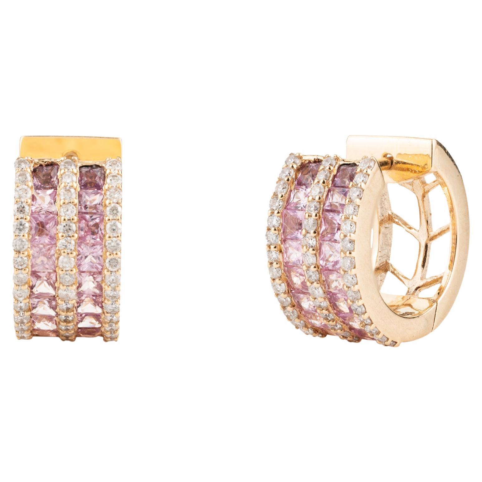 Pink Sapphire and Diamond Huggie Hoop Earring in 18K Gold to make a statement with your look. You shall need hoop earrings to make a statement with your look. These earrings create a sparkling, luxurious look featuring square cut pink sapphires and
