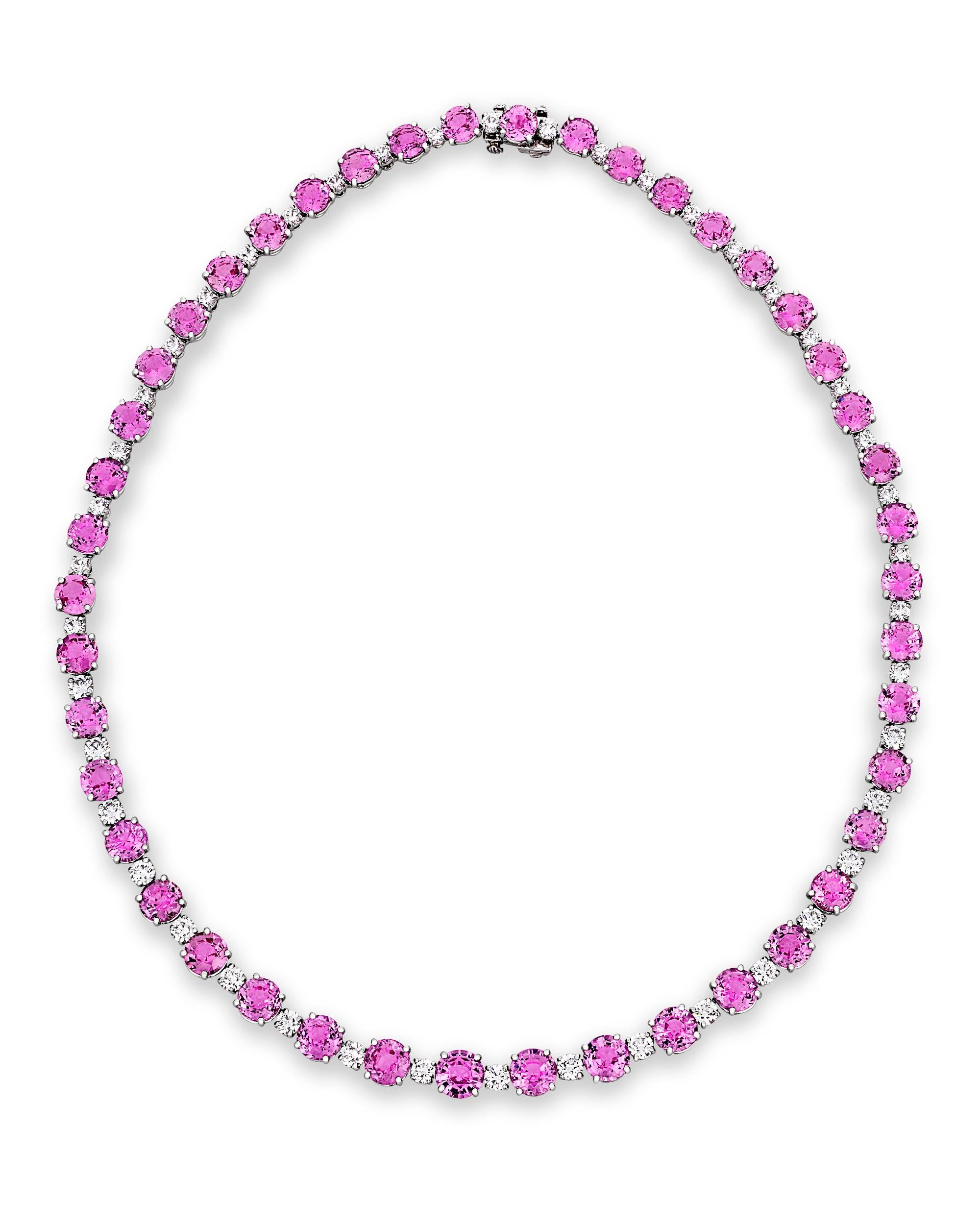 A stunning collection of 44 rare pink sapphires weighing 45.22 total carats are set into this necklace by the visionary American jeweler Oscar Heyman. The design alternates the perfectly-matched sapphires with 5.58 carats of white diamonds in a