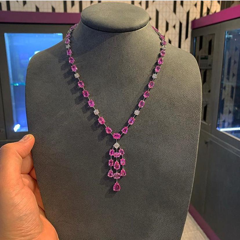 Pink Sapphire and Diamond Necklace

Approx
55 ct pink sapphire
5.65 ct diamonds

18 karat white gold