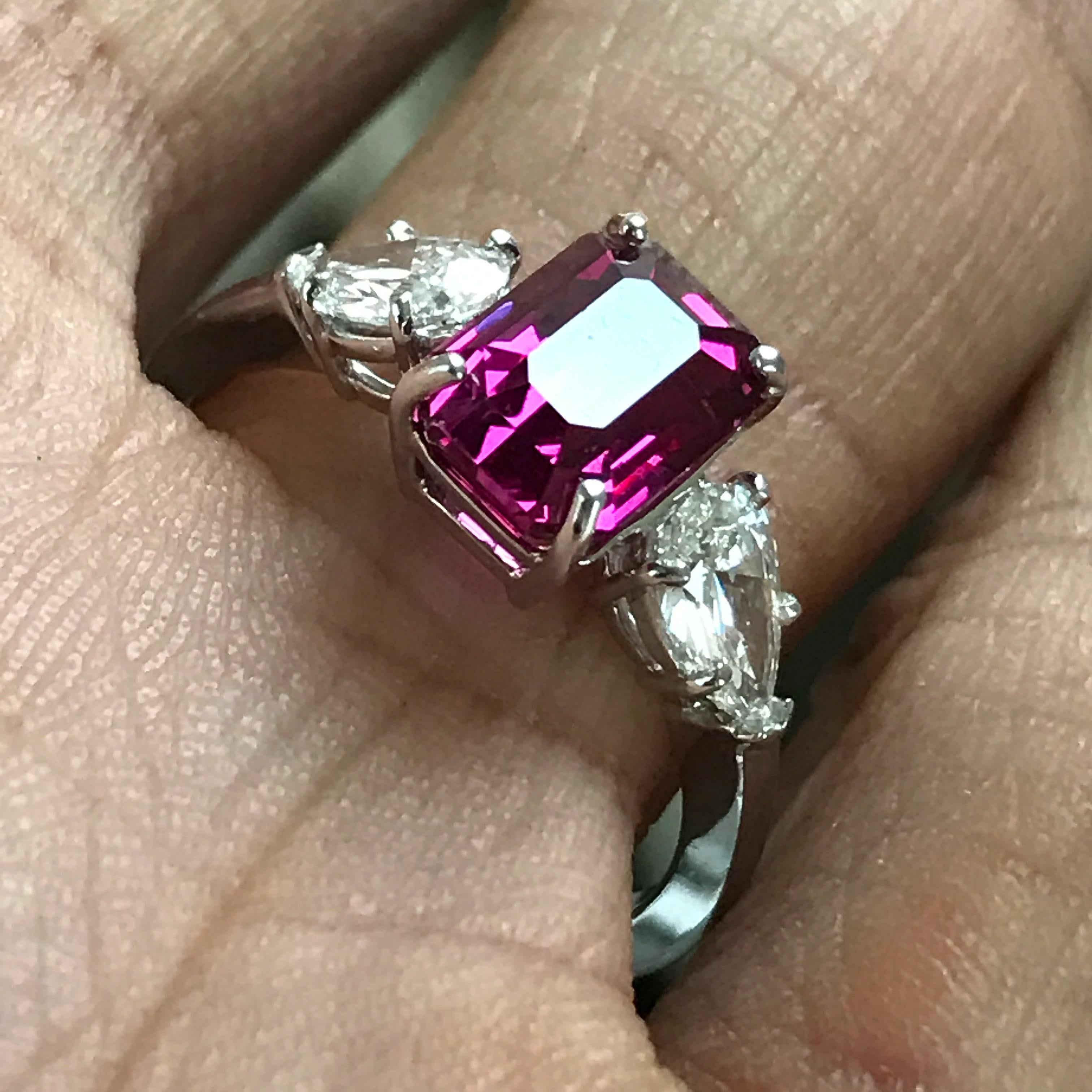 Main Stone Info:

1. Carat Weight: 2.8+ 

2. Color: Pink

3. Tone:  Medium - Nice, 7.0 Out of 10

4. Hue: Fancy Intense Pink.

3. Clarity:  Excellent clarity, no inclusions to the eye. VS if diamond rating.

4. Cut: This stone has a excellent