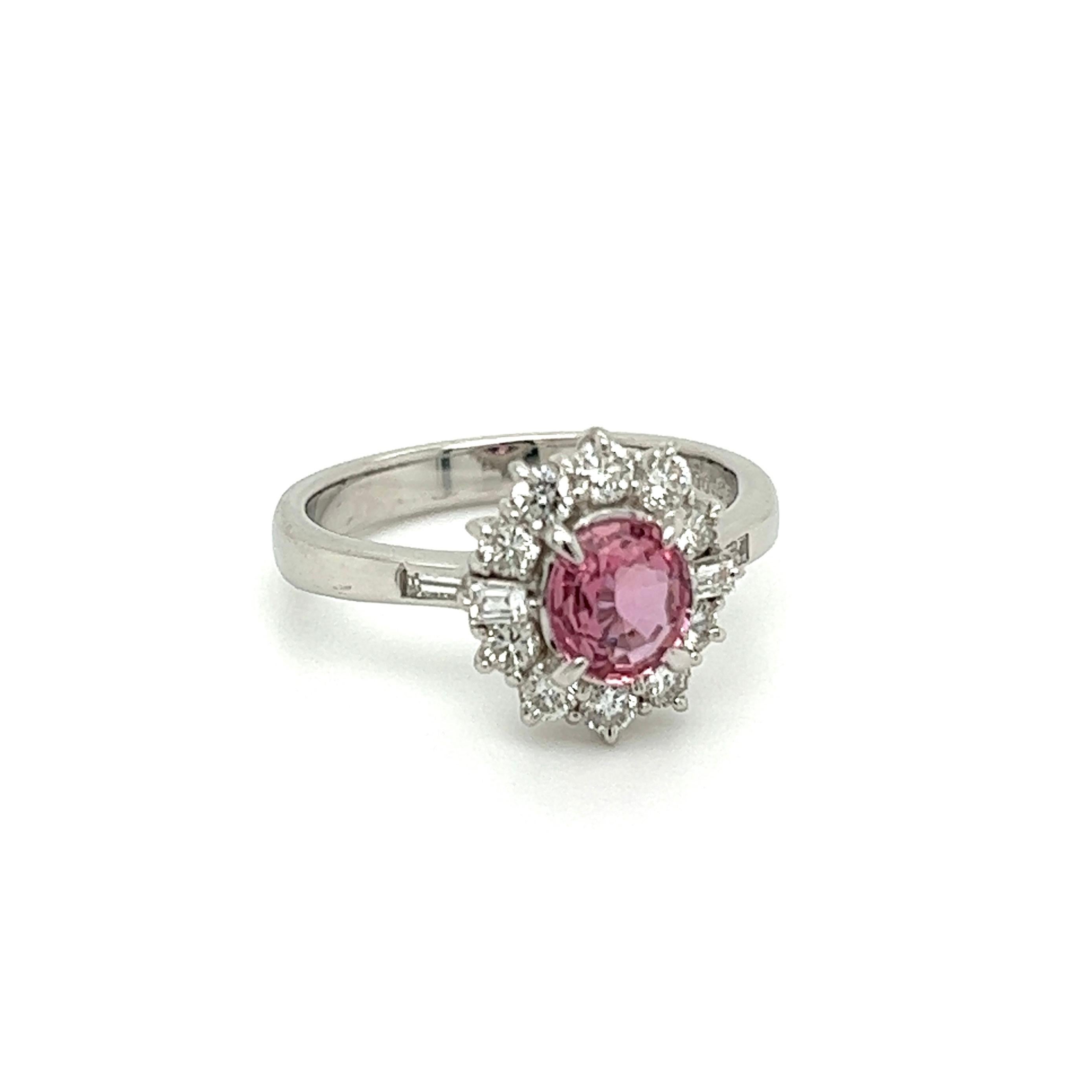 Simply Beautiful Pink Sapphire and Diamond Cocktail Ring. Centering a securely nestled Hand set Pink Sapphire weighing 0.82 Carat. Surrounded by Diamonds weighing approx. 0.55tcw. Hand crafted Platinum mounting. Dimensions: 0.94” l x 0.78” w x 0.46”
