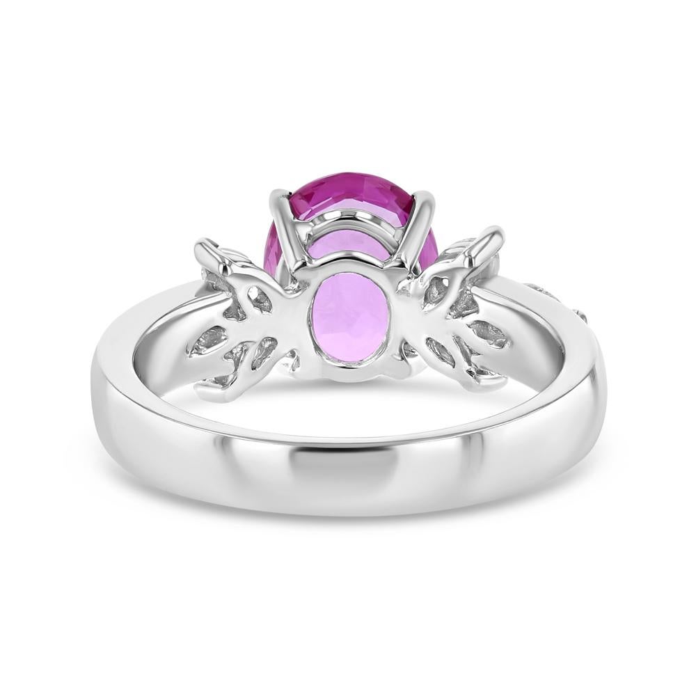  Add to wishlist

Please login to add items to wishlist.
This 18k white gold, pink sapphire, and diamond ring is an extraordinary treasure. It offers an elegant pop of color with a center set pink sapphire and three pear shaped diamonds fanning out