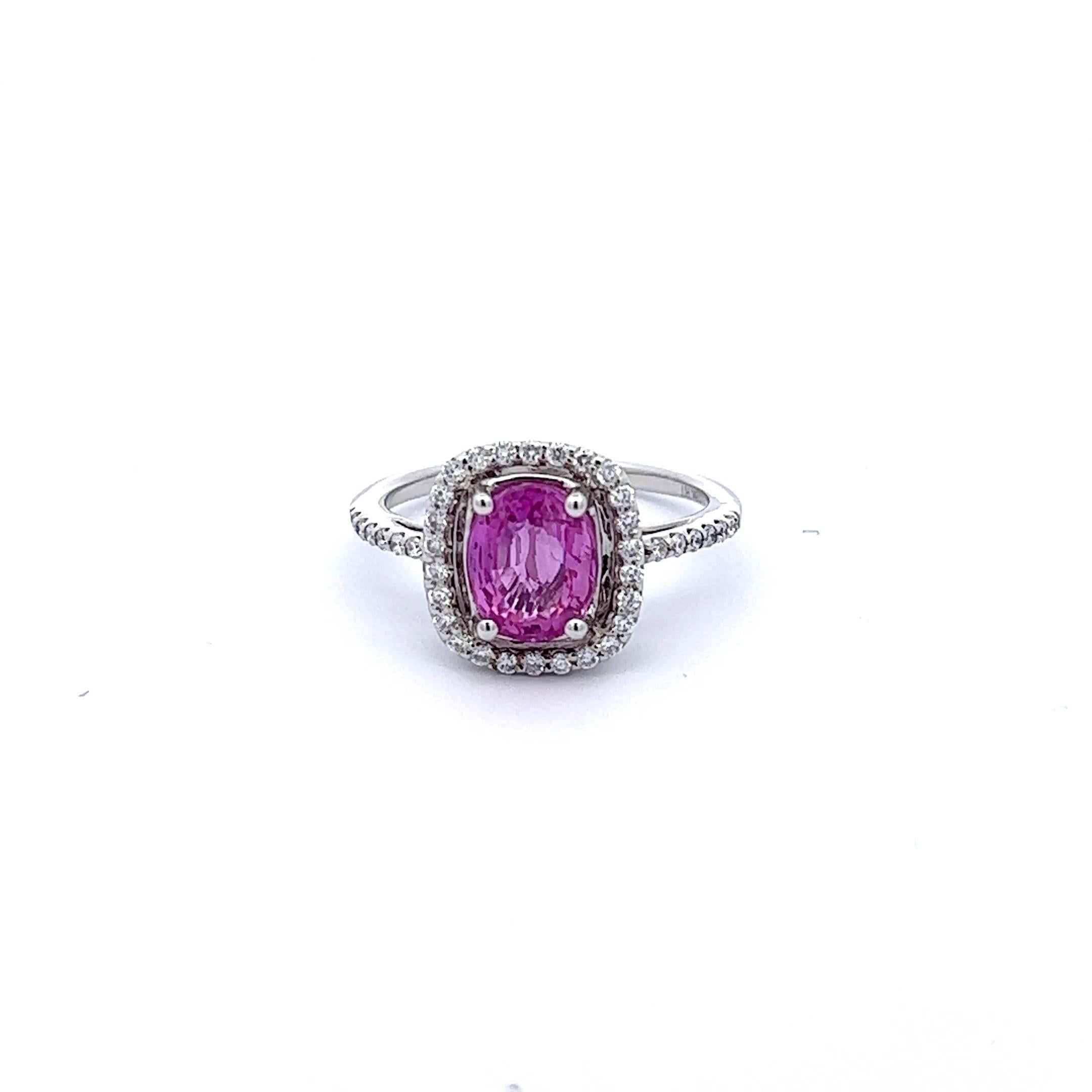 Introducing the stunning 2.32 carat Pink Sapphire Ring, an exceptional piece of jewelry that exudes elegance and grace. The centerpiece of this ring is a rare, natural pink sapphire, weighing in at an impressive 2.32 carats. The sapphire is set in a