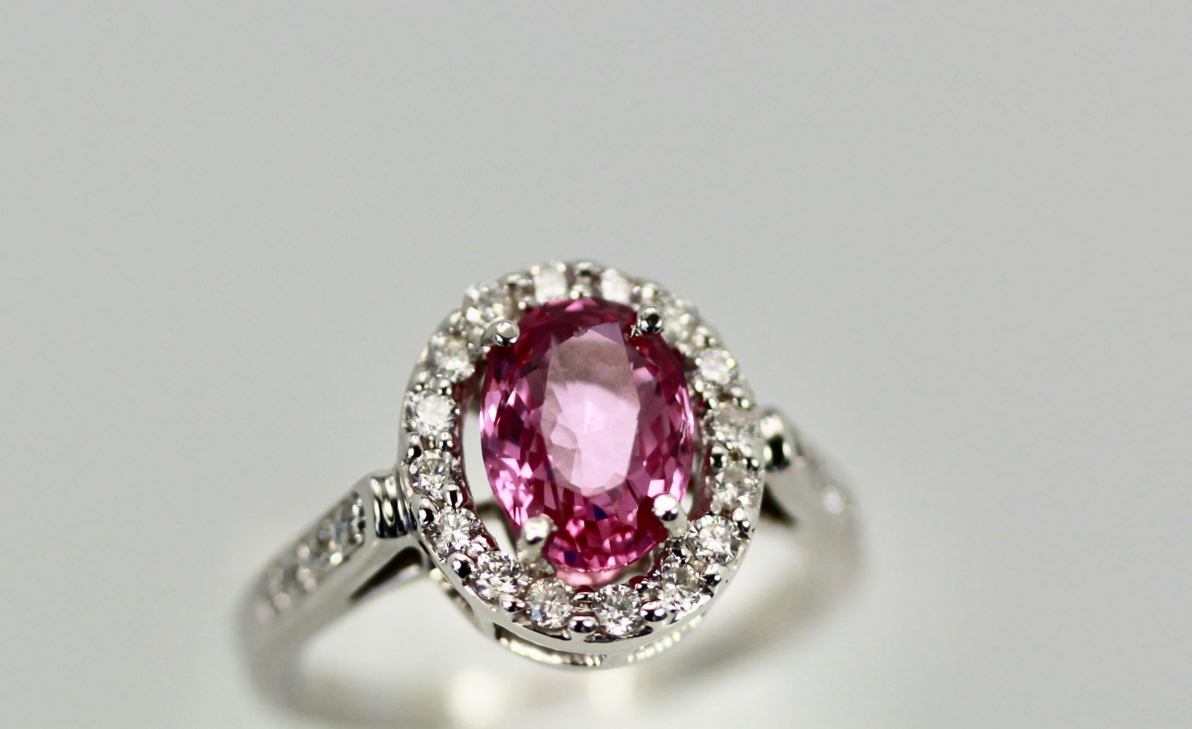 This Pink Sapphire is a gorgeous color of pink.  It weighs 1.20 carats and is set with a Diamond Halo around the stone and Diamonds going down the shank, it is lovely.  This is new 