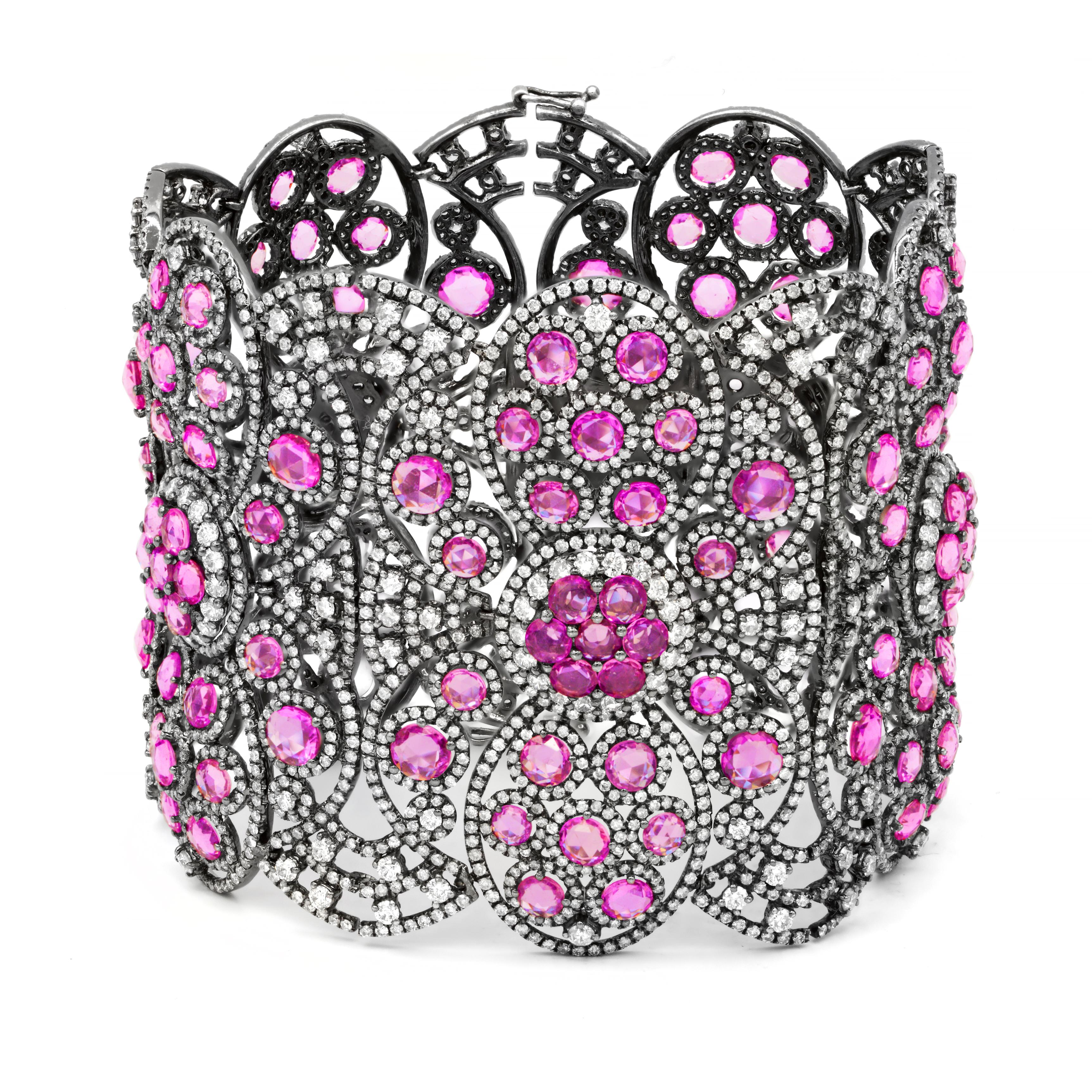 Hand made antique style soft bangle bracelet. 
Absolutely magnificent Pink sapphire and diamond bracet with black rhodium that makes combination of pink sapphires and diamonds pop. 
34.32 Carats of Natural Pink Sapphires set with 24.95 Carats of