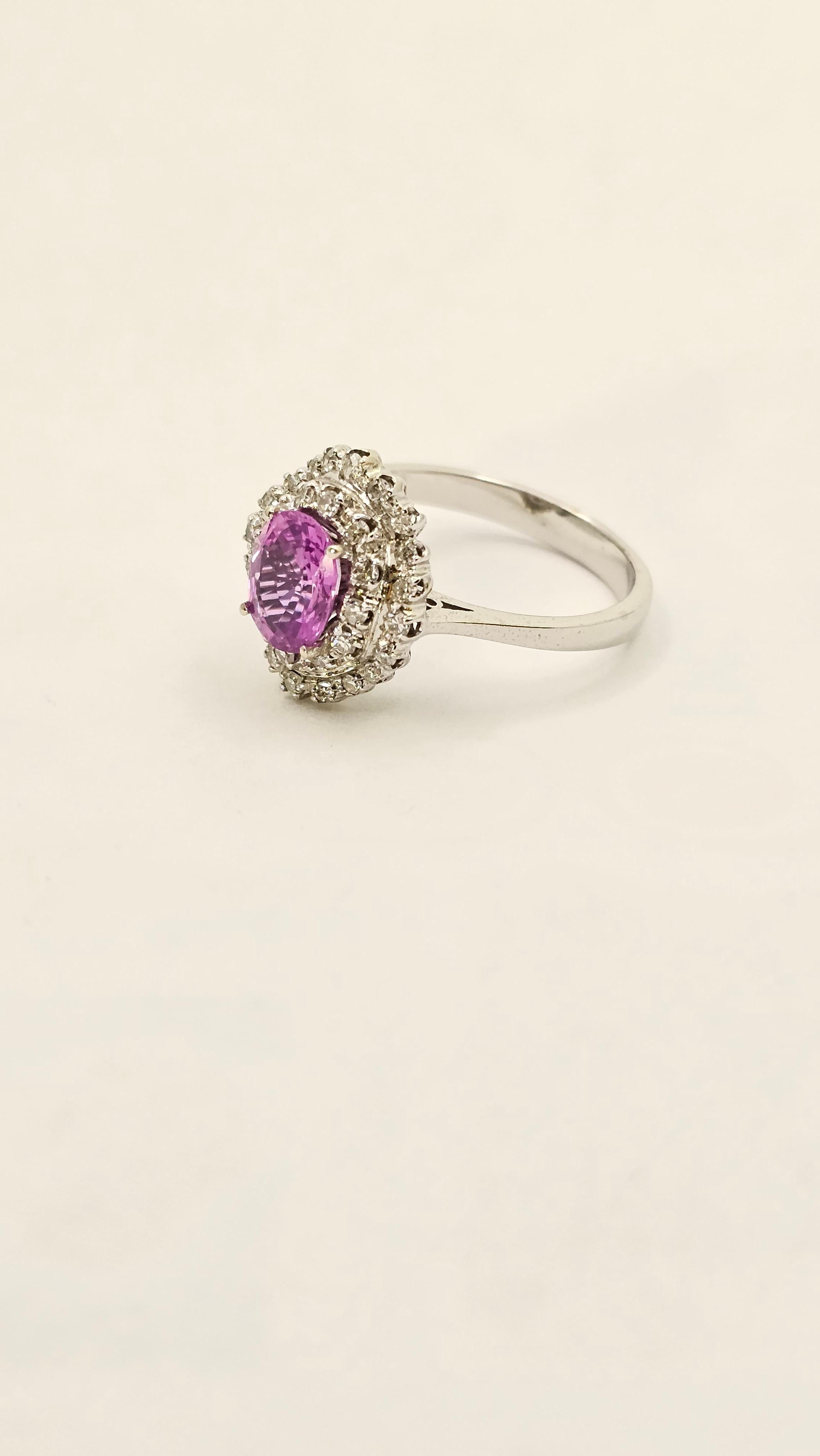 Handmade ring made in 18 Kt white gold ( gr 3.90 ).
The ring has an intense pink oval cut sapphire ( ct 1.27 ) and two row of white diamonds.
The ring is new and It comes with warranty certificate.
Ring size 6 ( 52 and an half ). This ring can be