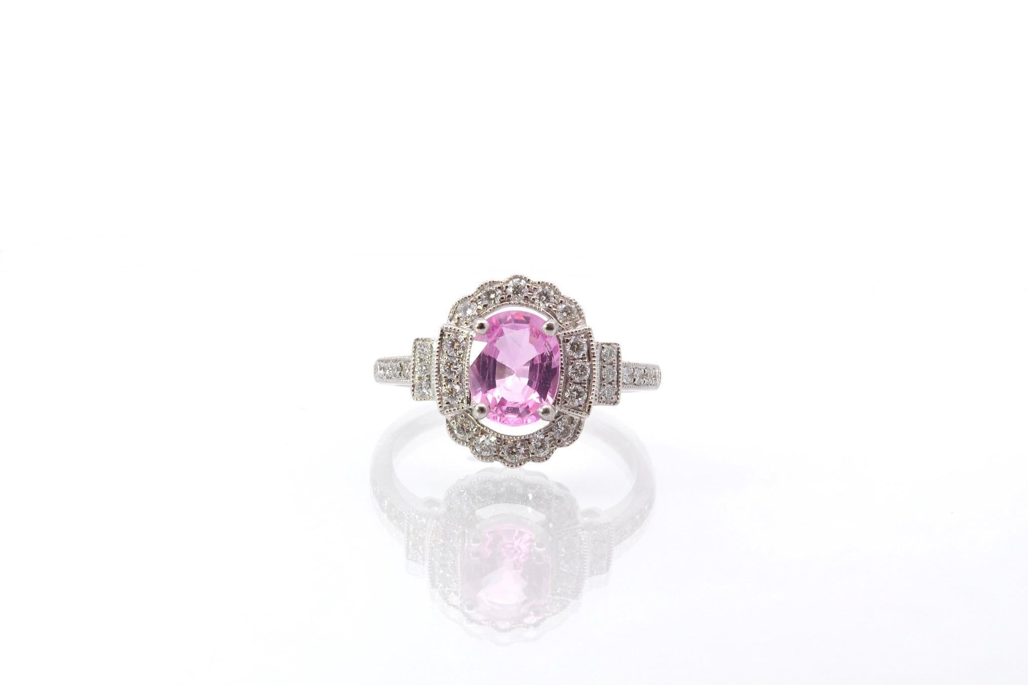 Stones: Oval pink sapphire: 1.19 cts, 30 diamonds: 0.30 ct
Material: 18k white gold
Dimensions: 1.2 x 1cm
Weight: 3.6g
Period: Recent vintage style
Size: 52 (free sizing)
Certificate
Ref. : 25566