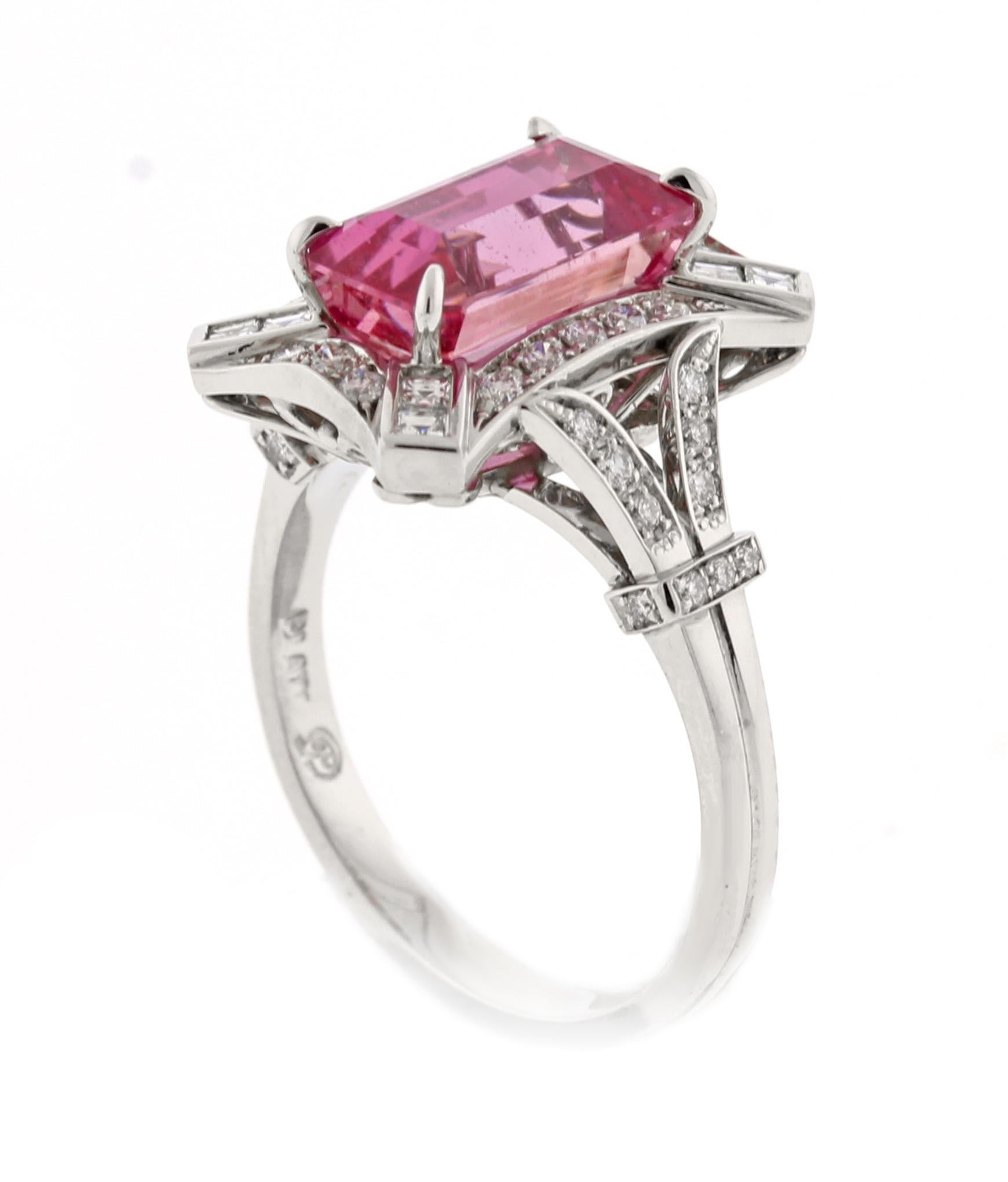 From the master ring makers of Pampillonia jewelers an emerald cut hot pink sapphire and diamond handmade ring
♦ Designer: Pampillonia
♦ Metal: Platinum
♦ Pink Emerald cut sapphire=3.92
♦ 49D=.45
♦ Circa 2020
♦ Size 6, Resizable
♦ Packaging: