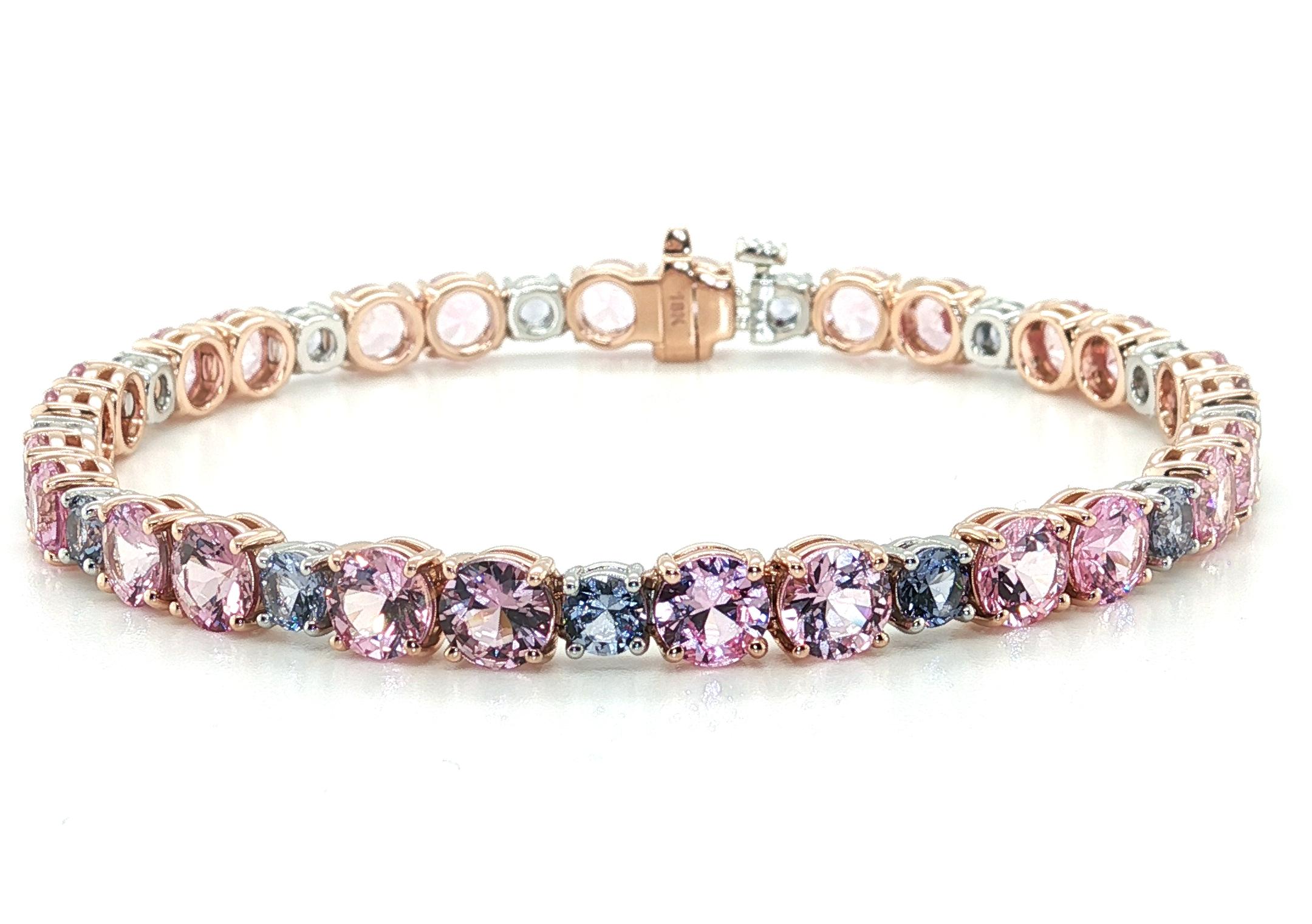 This one-of-a-kind tennis bracelet features a breathtaking collection of exceptionally high-quality pink sapphires and lavender spinels set in platinum and 18k rose gold. The larger round pink sapphires weigh a total of 12.47 carats, and have an