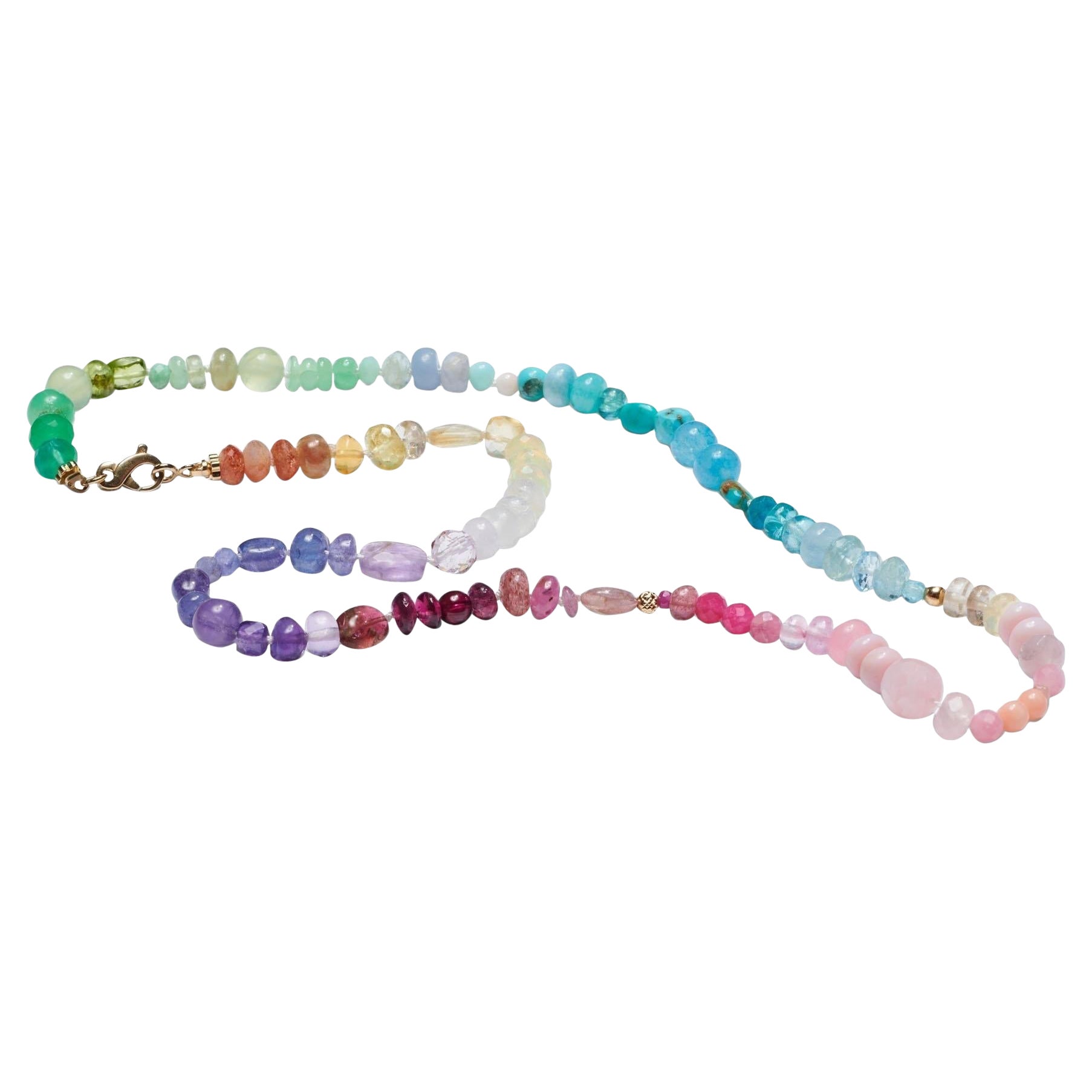Embrace yourself with sparkling gemstones that capture the colours of the rainbow! The facetted shapes of the stones enhance this necklace’s beauty, with  stones featuring facetted cuts and different shapes that catch the light in dazzling ways.