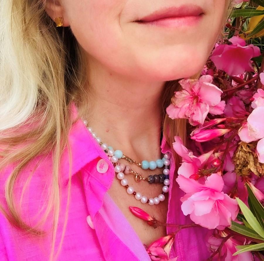 The classic white pearl necklace with white freshwater pearls, sparkling pink tourmalines and sapphires! Colors vary from a blush -to a deep saturated pink, hand knotted on pink silk thread, finished with an 14k solid gold clasp.

• White freshwater