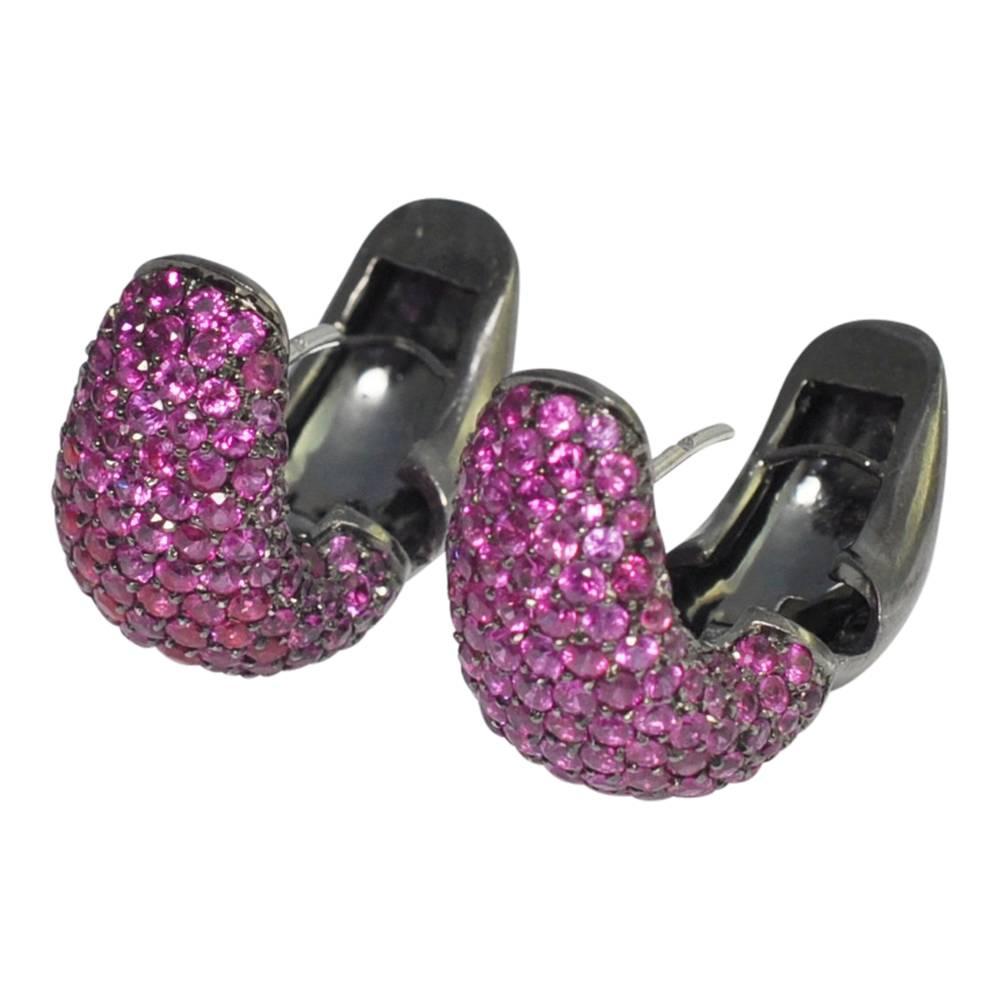 For girls who love pink!  These amazing earrings are set with rich pink sapphires, full of fire,  which sparkle and shimmer, contrasting with the black gold they are set in.  Each earring has approximately 2.5ct of sapphires.  The earrings open and