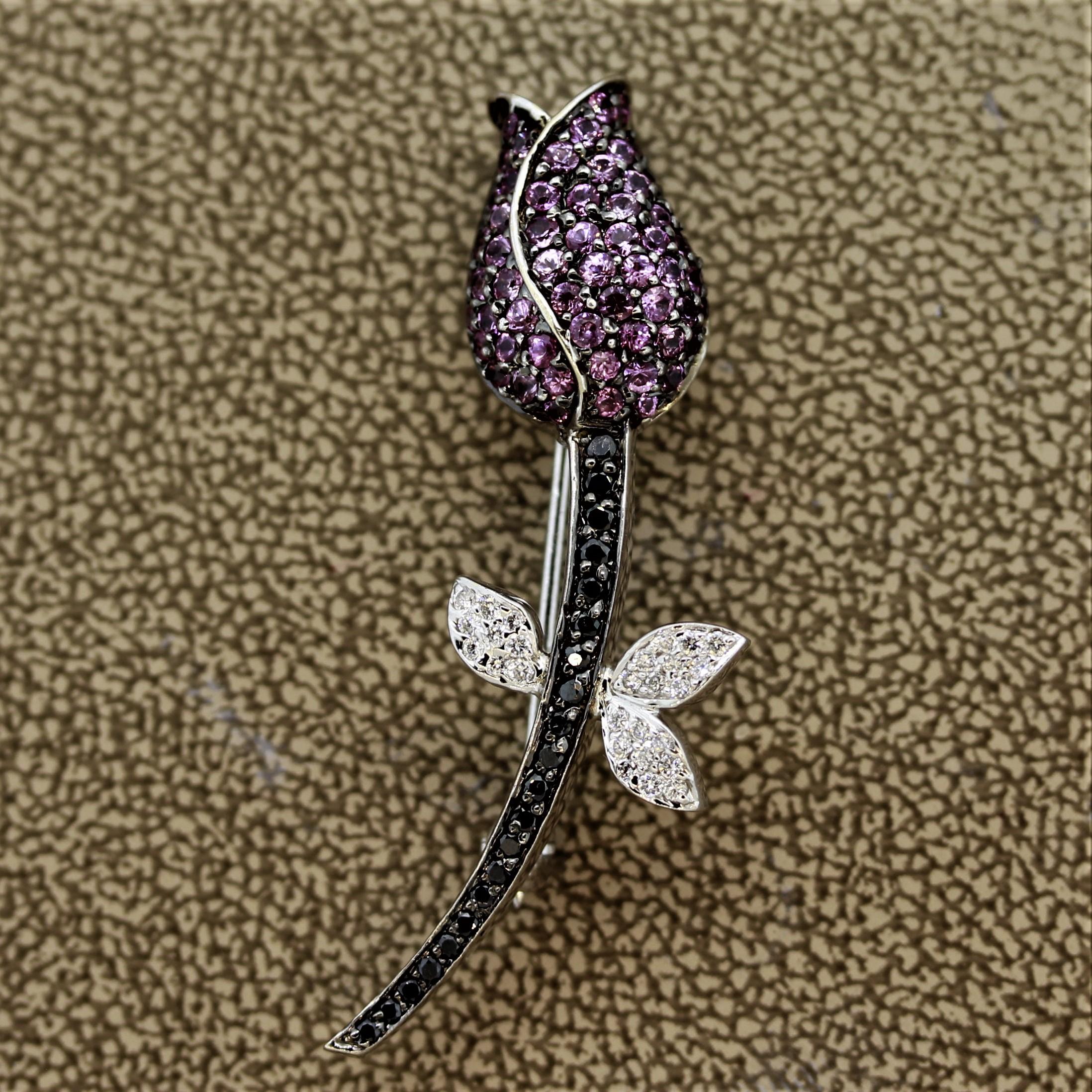 This sweet pin features 0.54 carats of pink sapphires along with 1.77 carats of black and white diamonds. Made in 18k white gold and a size that allows the piece to be worn casually with multiple outfits.

Length: 1.2 inches