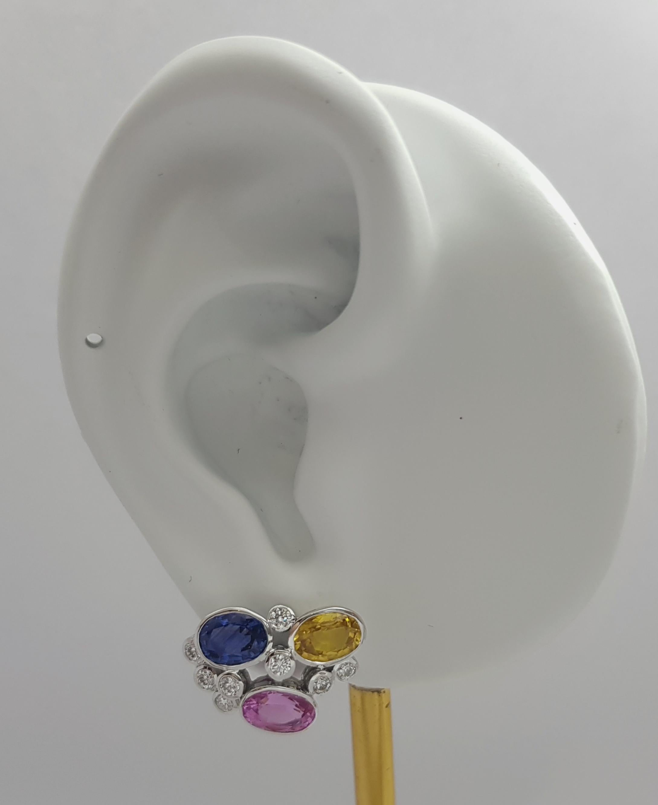 Pink Sapphire 2.38 carats, Blue Sapphire2.09 carats, Yellow Sapphire 2.29 carats with Diamond 0.62 carats Earrings set in 18K White Gold Settings

Width: 1.2 cm 
Length: 1.9 cm
Total Weight: 7.55 grams

