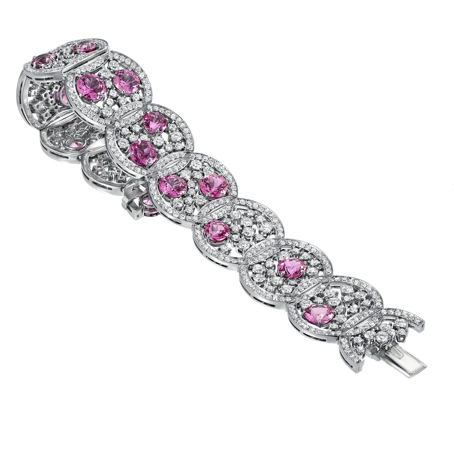 Exceptional platinum bracelet, set with 15 ultra fine round Pink Sapphires, weighing a total of 19.54 carats, and round brilliant diamonds weighing a total of 10.99 carats.
Total length: 7 inches.
Total width: 1.75 inches.
Returns are accepted and