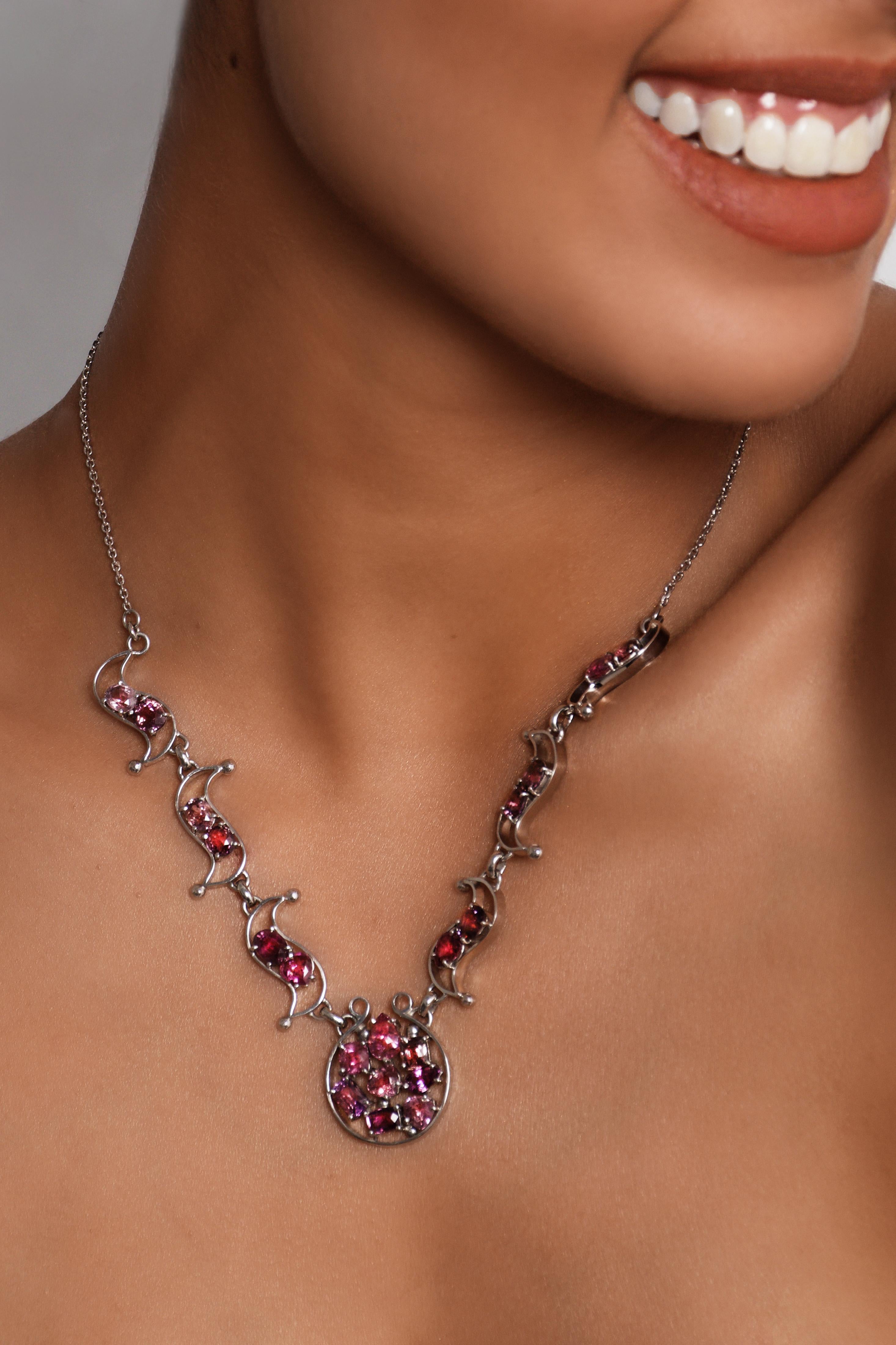 Introducing our exquisite Pink Saphire Celebration Necklace, a masterpiece that adds a touch of elegance to your joyous moments.
Crafted by skilled artisans, this necklace features a stunning arrangement of 20x natural origin Sapphires of various