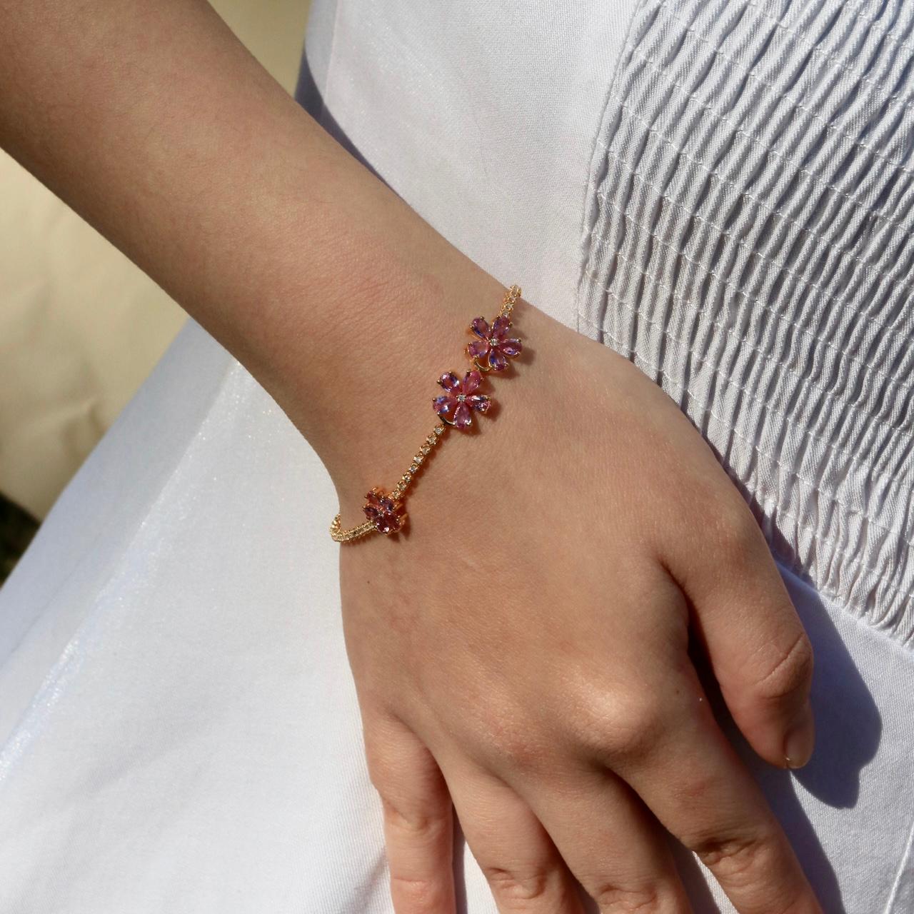 Women's Pink Sapphire Cherry Blossom Diamond Tennis Bracelet in 18k Yellow Gold For Sale