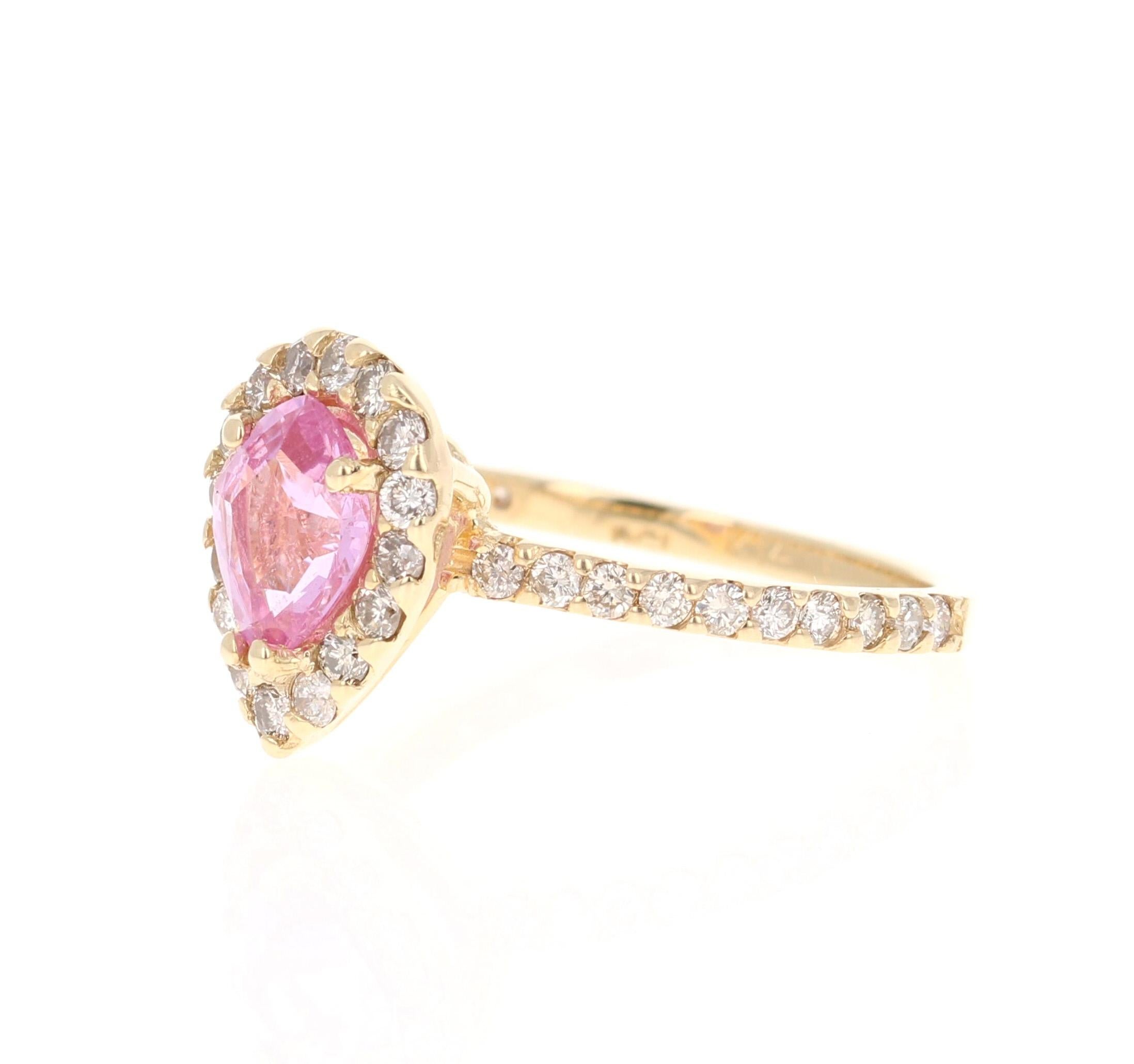 This beautiful ring has a 1.24 Carat Pear Cut Pink Sapphire and is surrounded by 36 Round Cut Diamonds that weigh 0.66 Carats. The total carat weight of the ring is 1.90 Carats. 

The ring is beautifully set in 14K Rose Gold with an approximate