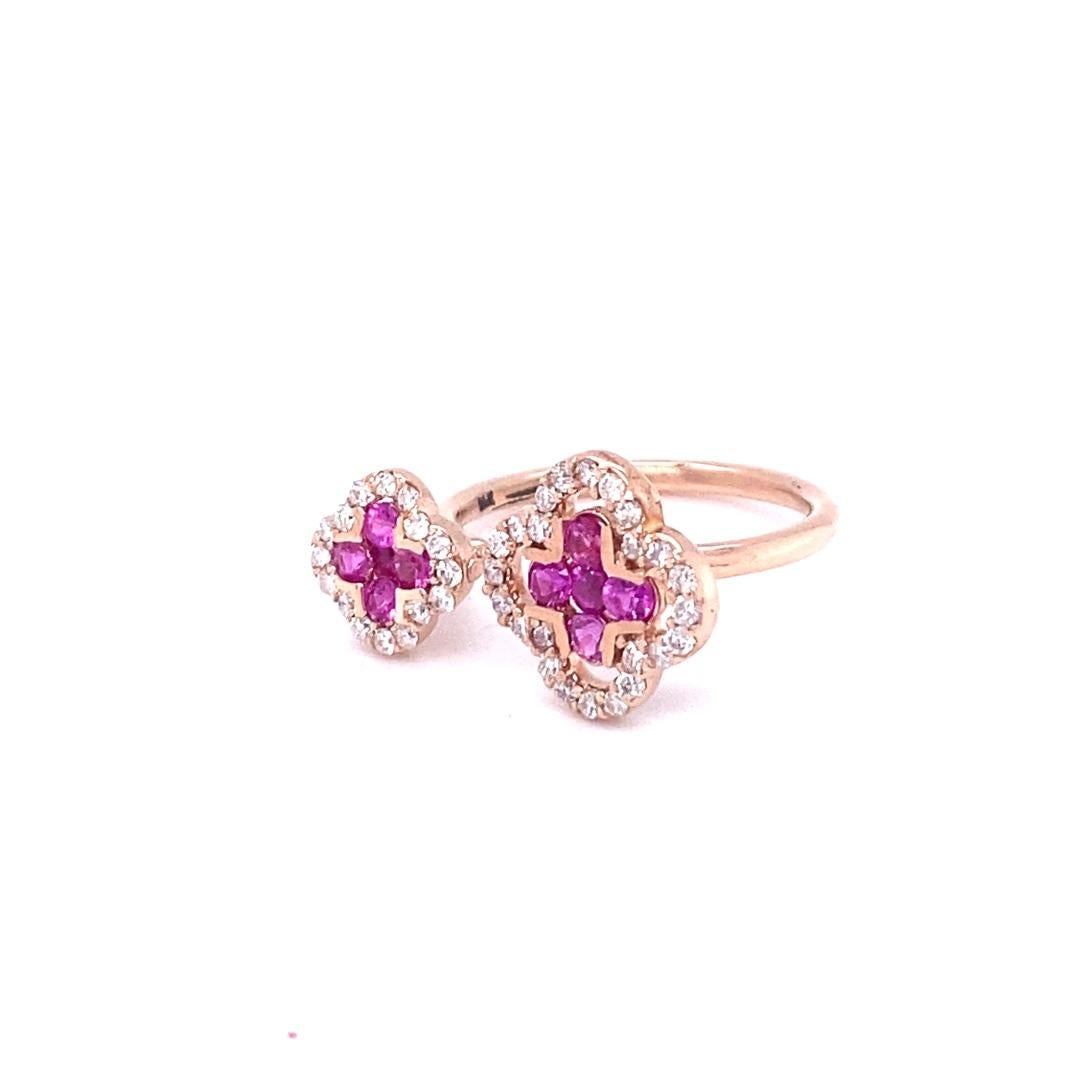 Pink Sapphire Diamond 14 Karat Rose Gold Ring

This designer inspired ring has 40 Round Cut Diamonds that weigh 0.35 Carats (Clarity: SI2, Color: F) and 10 Round Cut Pink Sapphires that weigh 0.55 Carats.  The total carat weight of the ring is 0.90