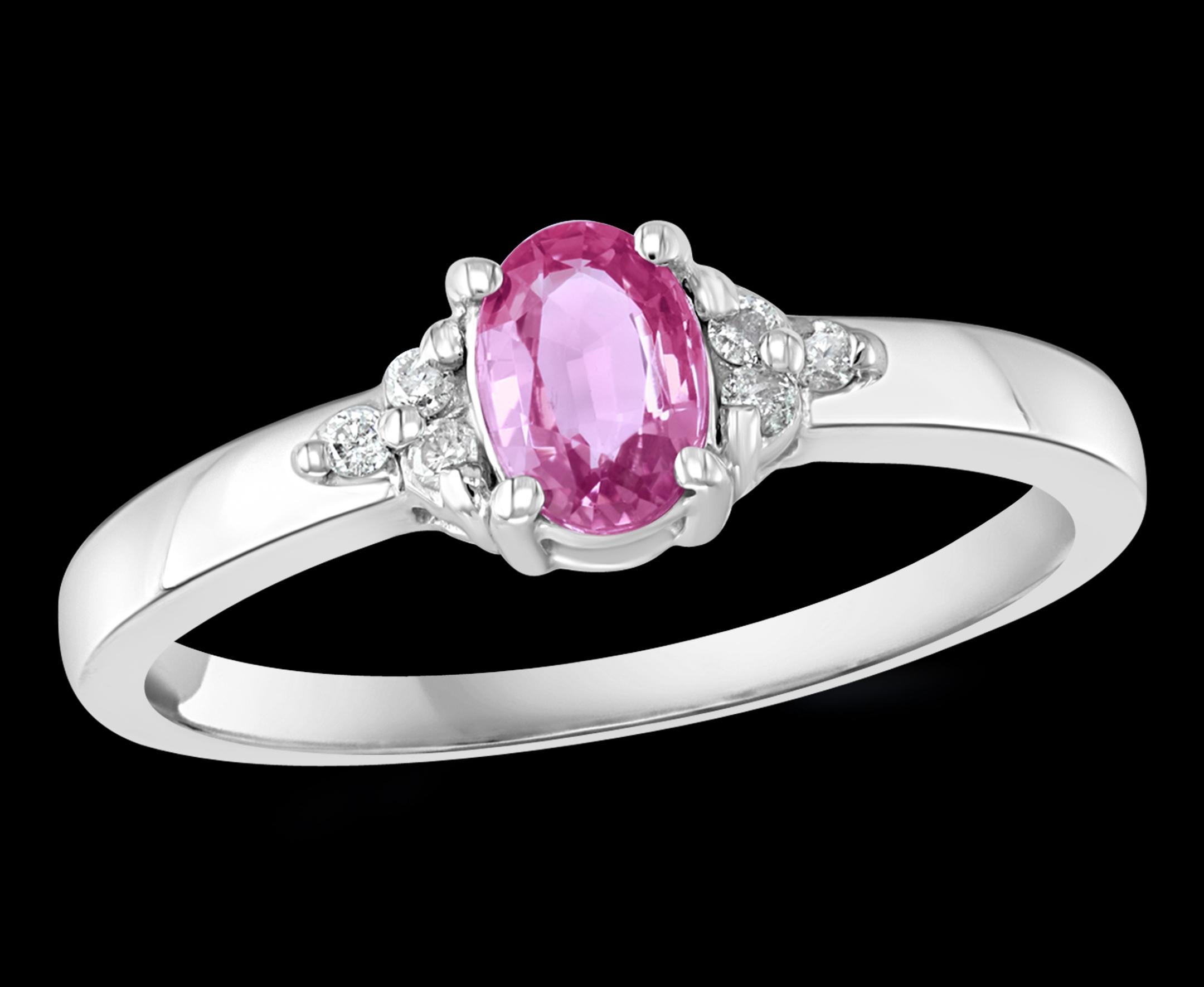 A classic, Ring 
Approximately 0.25  Ct natural Pink sapphire and 6 Round   Diamond 14 Karat  White gold   Ring
Makes a nice gift for Pre Teen or Teen girls or even young adults.
 All round brilliant cut diamonds
14 Karat White  Gold: 2.1  Grams
