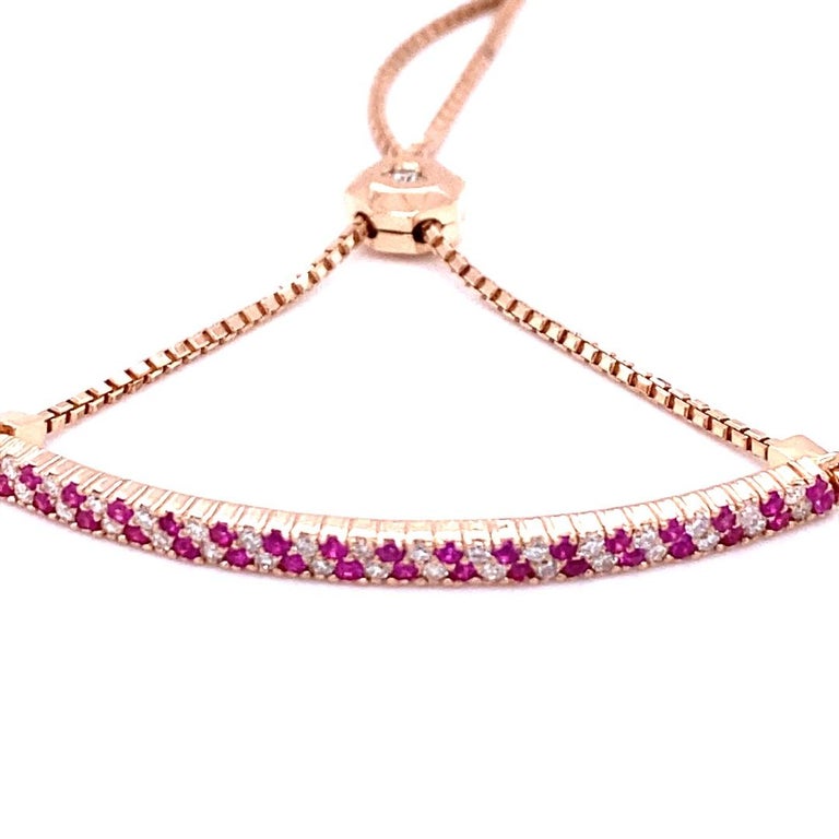 Dainty, Delicate, and Beautiful. 
A 14K Rose Gold Pink Sapphire and Diamond Bracelet with an adjustable design for the perfect fit!

There are 33 Round Cut Pink Sapphires that weigh 0.36 Carats and 35 Round Cut Diamonds that weigh 0.33 Carats