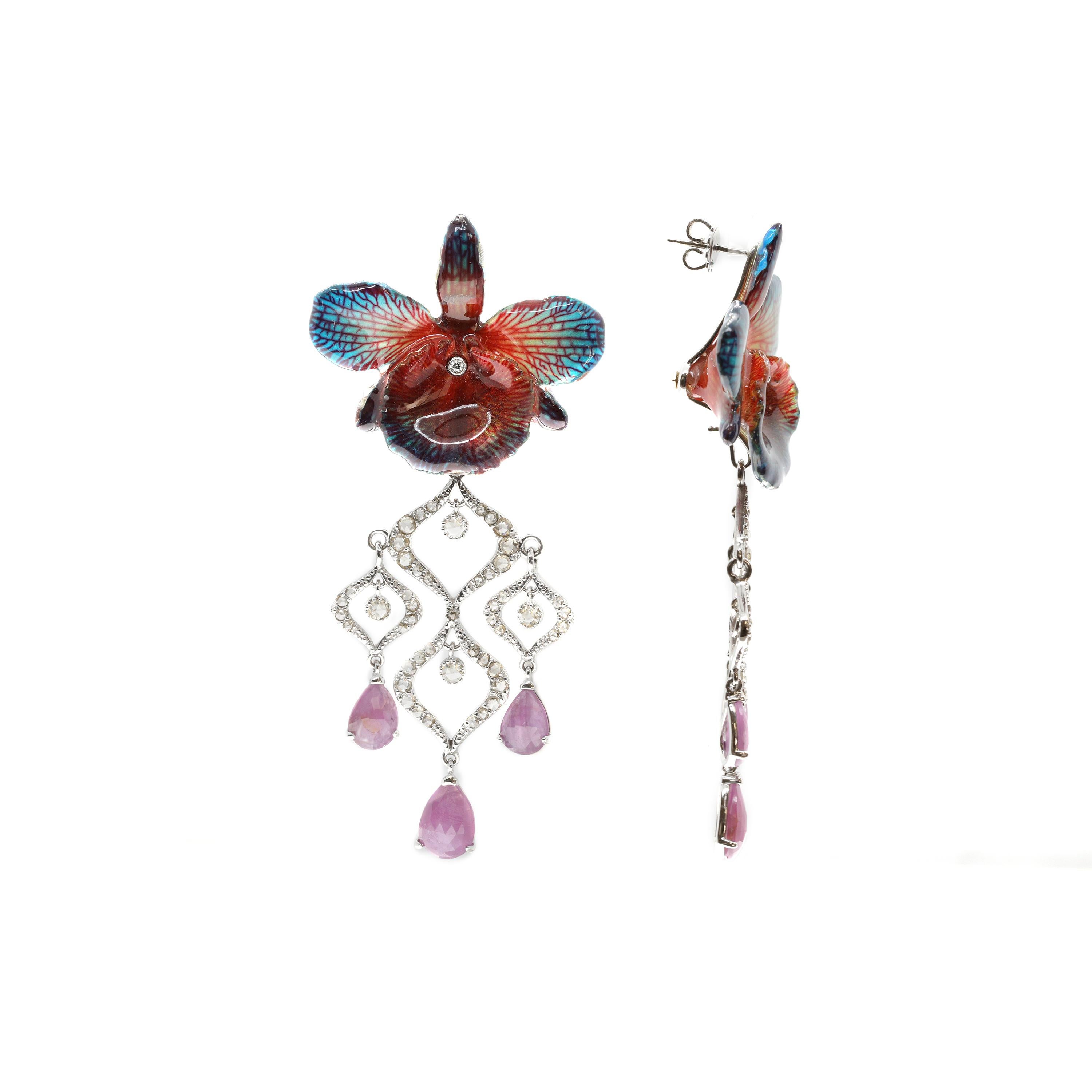 These vibrant post-back floral earrings have been masterfully created entirely by hand. Each features a real orchid, which has been transformed to preserve its beauty for eternity. The orchid colours range from a deep red at the edges to a brilliant