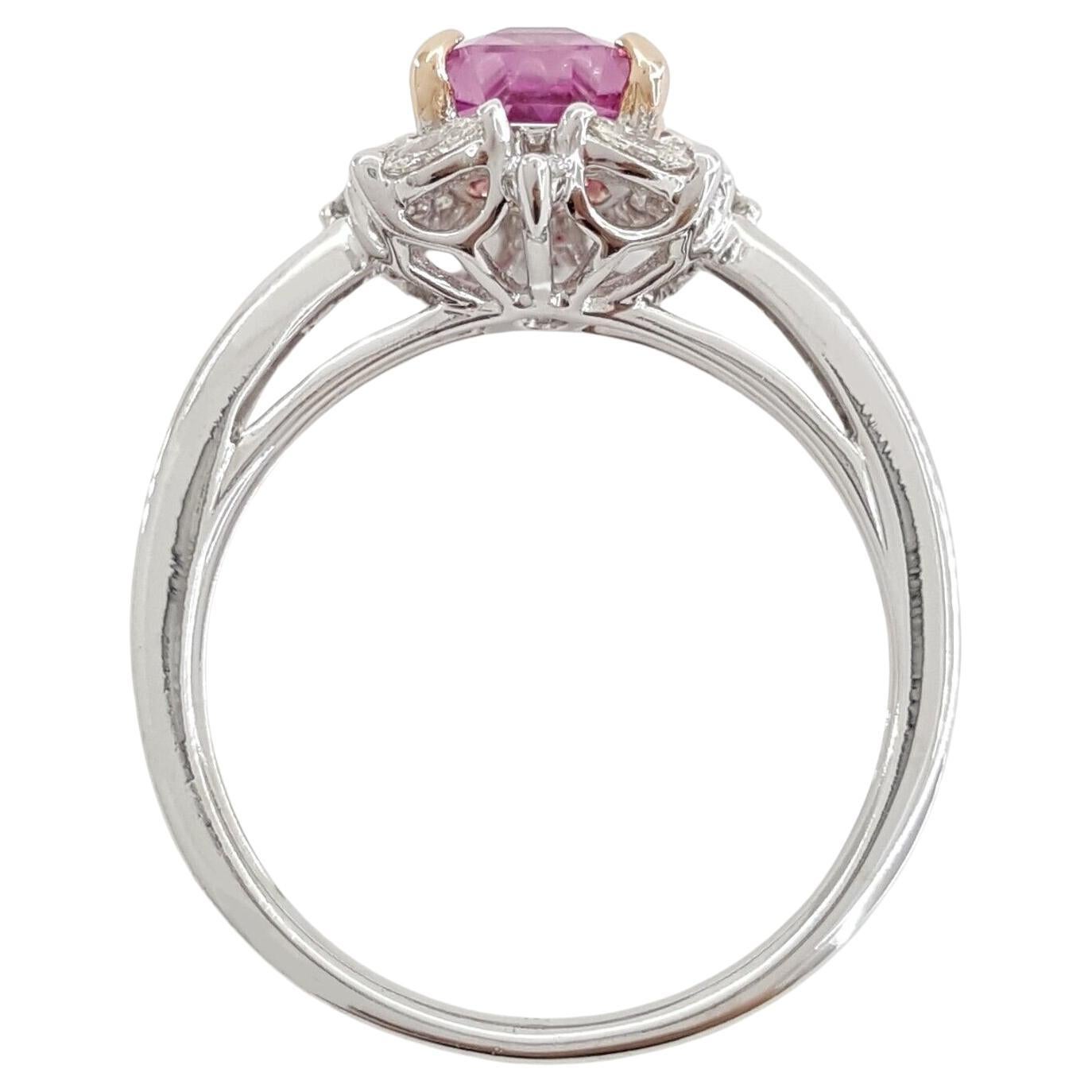 An Engagement/Anniversary Ring in 18k White & Rose Gold features a total weight of 2.4 carats, highlighting an Emerald Cut Pink Sapphire surrounded by a halo of Round and Marquise Cut Diamonds. Weighing 3.7 grams and sized 6.5, the central stone is
