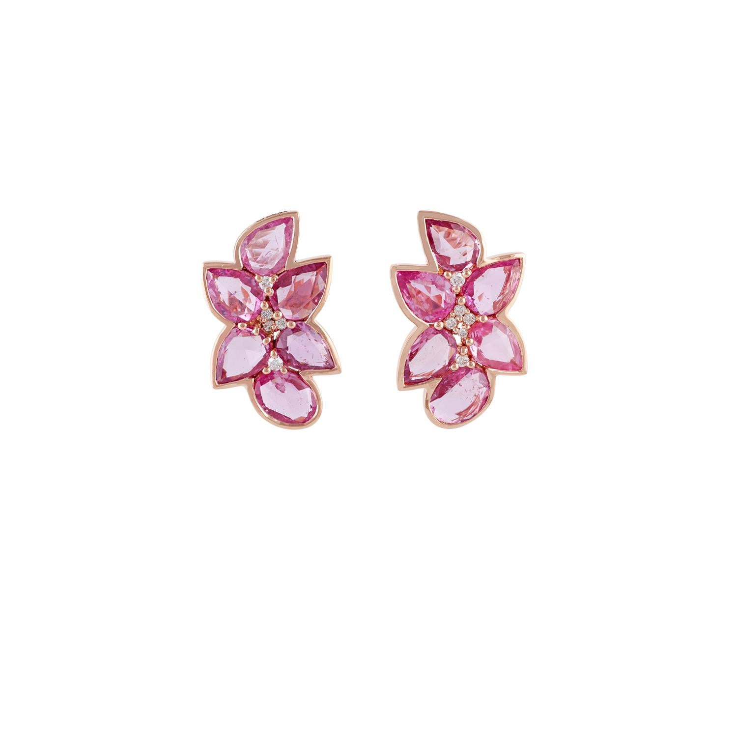 These are an exclusive pair of earrings with pink sapphires and diamonds features 12 pieces of pear & oval-shaped pink sapphires are 7.14 carat & 11 pieces of round brilliant cut diamonds are 0.12 carat, these entire earrings are made in 18 karat