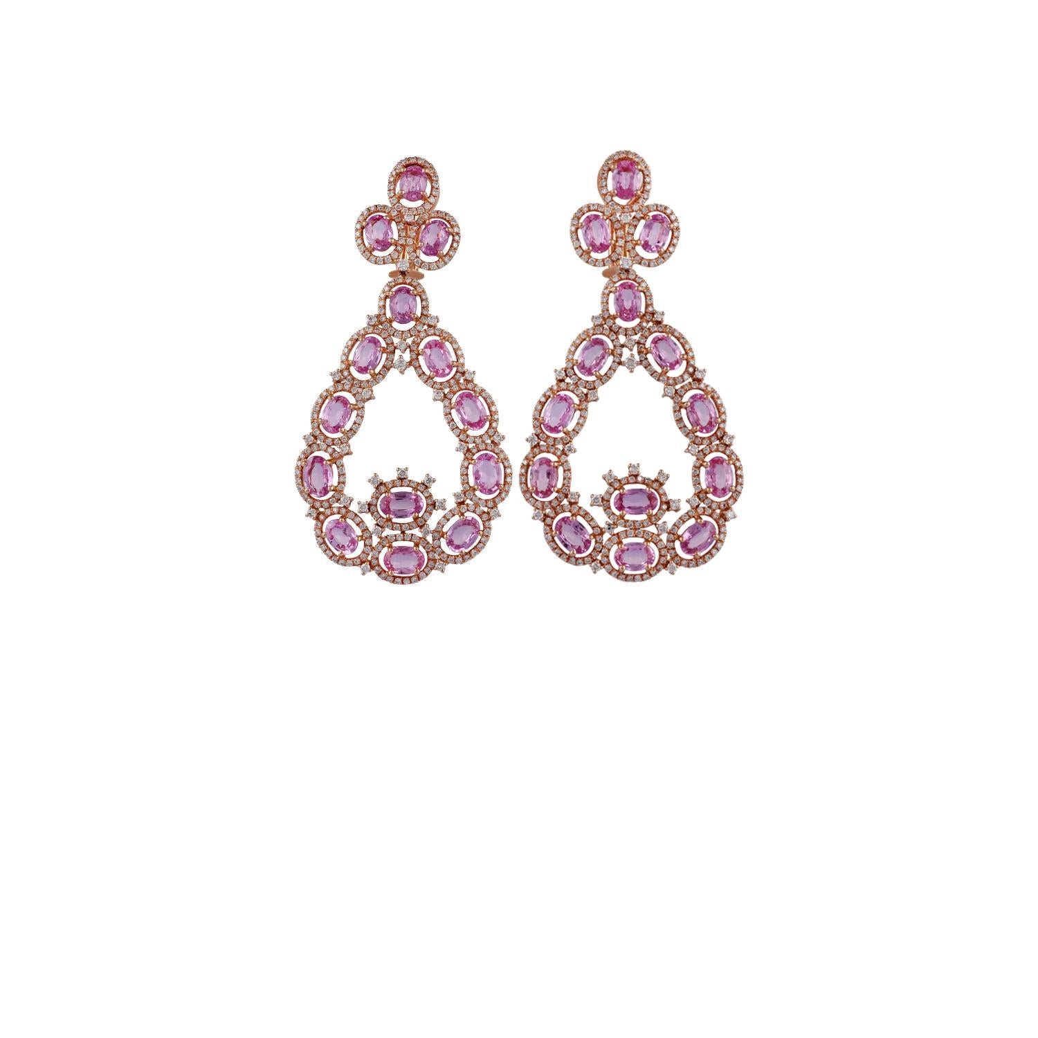 These are exclusive designer earrings studded in 18K rose gold, features 28 pieces of oval-shaped pink sapphires weight 15.70 carats & 614 pieces of round shaped diamonds weight 3.60 carats, the entire earrings are studded in 18K rose gold weight