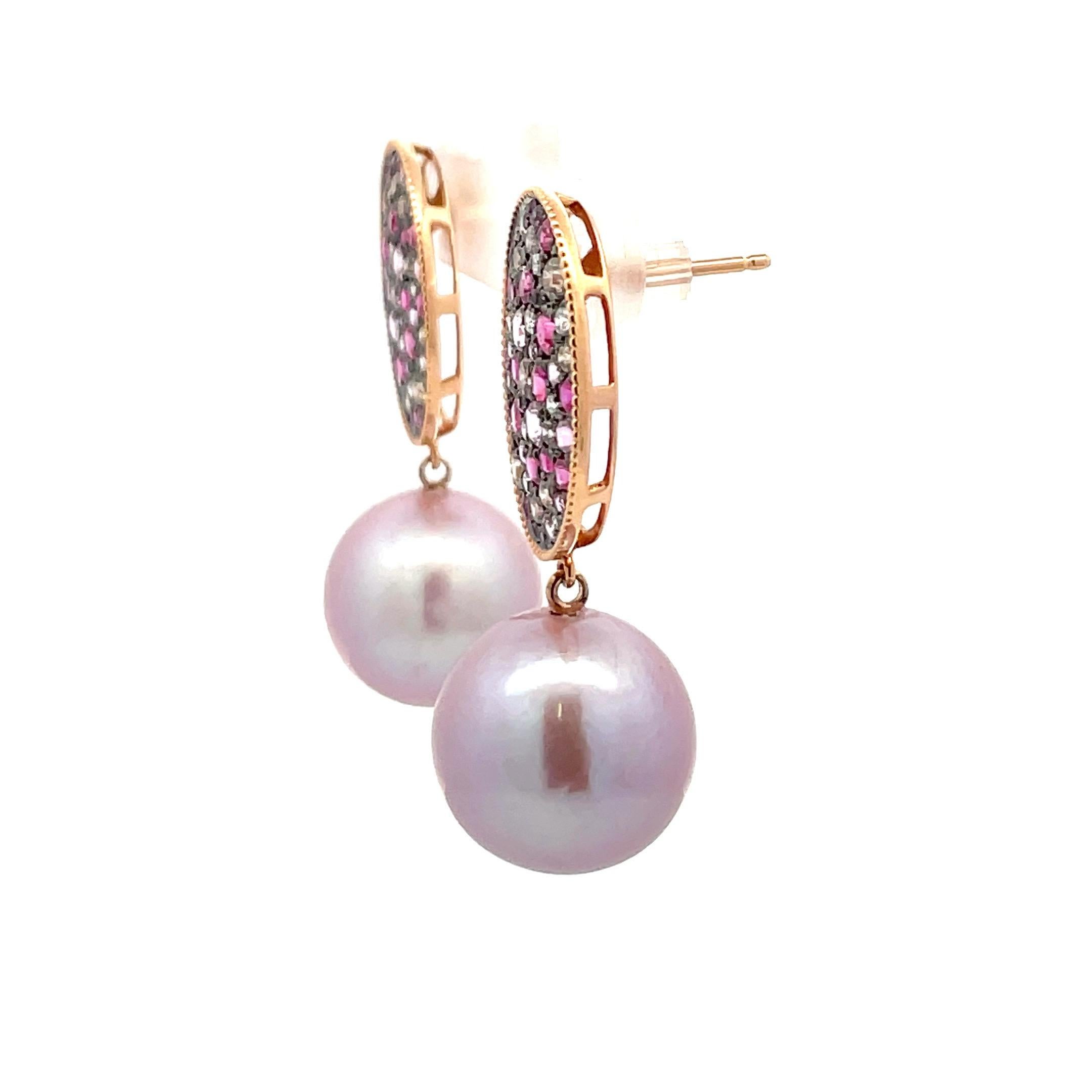 18 Karat Rose Gold drop earrings featuring 32 pink Sapphires weighing 0.85 Carats and 74 white & champagne color diamonds weighing 2.20 Carats with two pink Freshwater Pearls measuring 14-15 MM.

Pearls earrings can be changed to Tahitian, Pink,