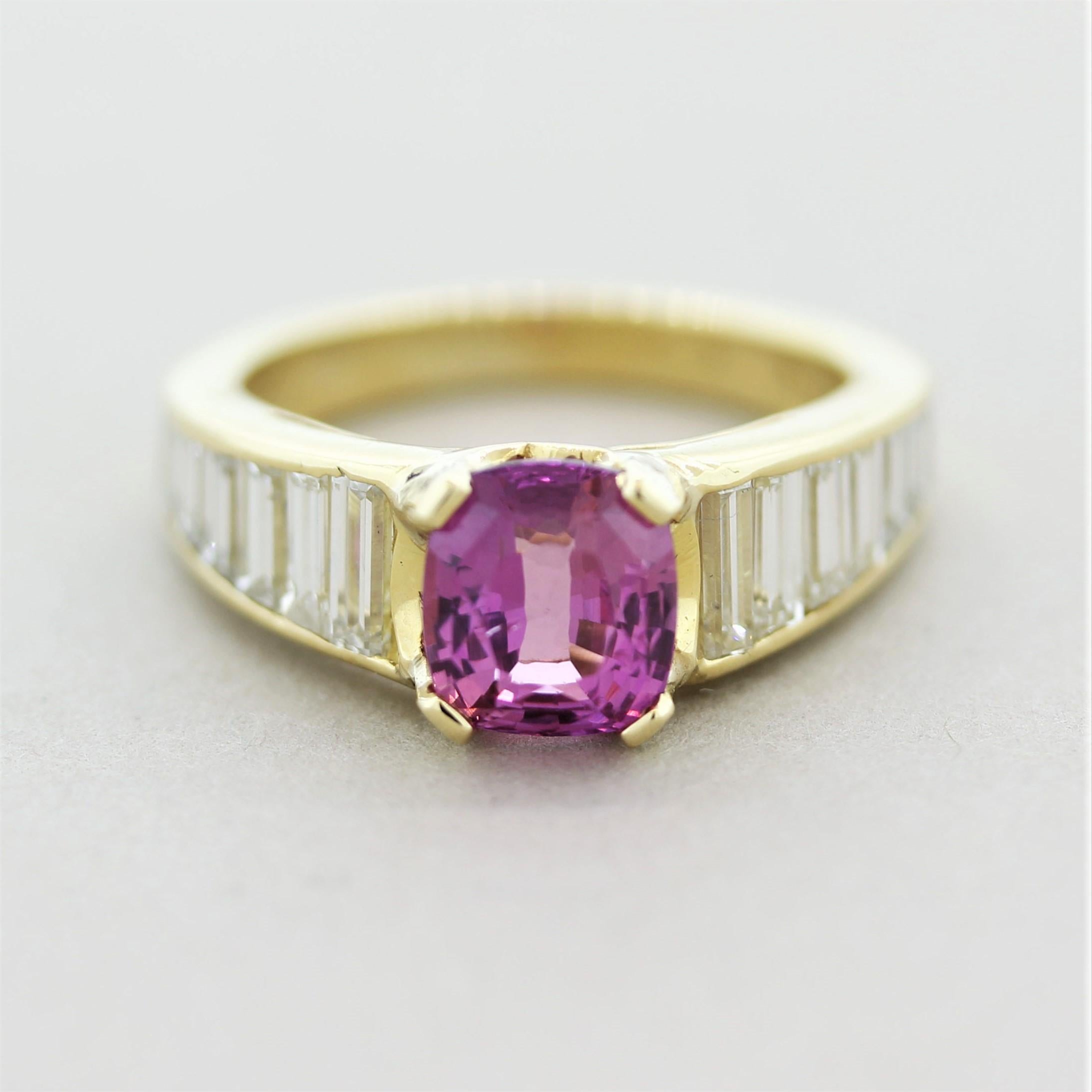 A beautiful and classy ring featuring a fine pink sapphire weighing 2.02 carats. It has a lovely cushion shape with a vivid purplish-pink color with excellent brilliance. It is accented by 1.78 carats of baguette-cut diamonds with VS clarity and F-G