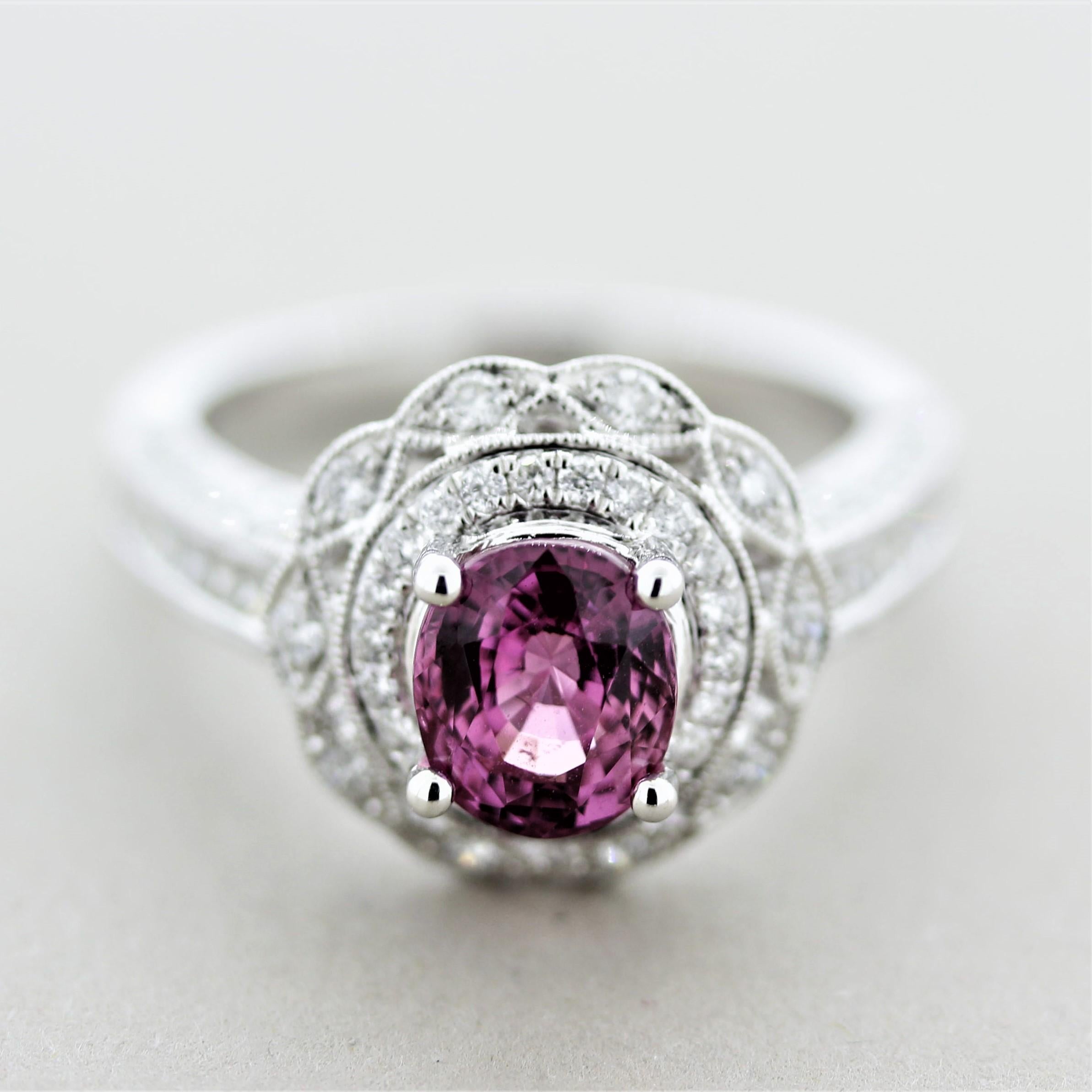 A sweet ring featuring a fine sapphire weighing 2.05 carats with a vivid purplish-pink color and excellent brilliance due to its fine cutting. It is accented by 1.19 carats of round brilliant-cut diamonds set around the sapphire as well as pave-set