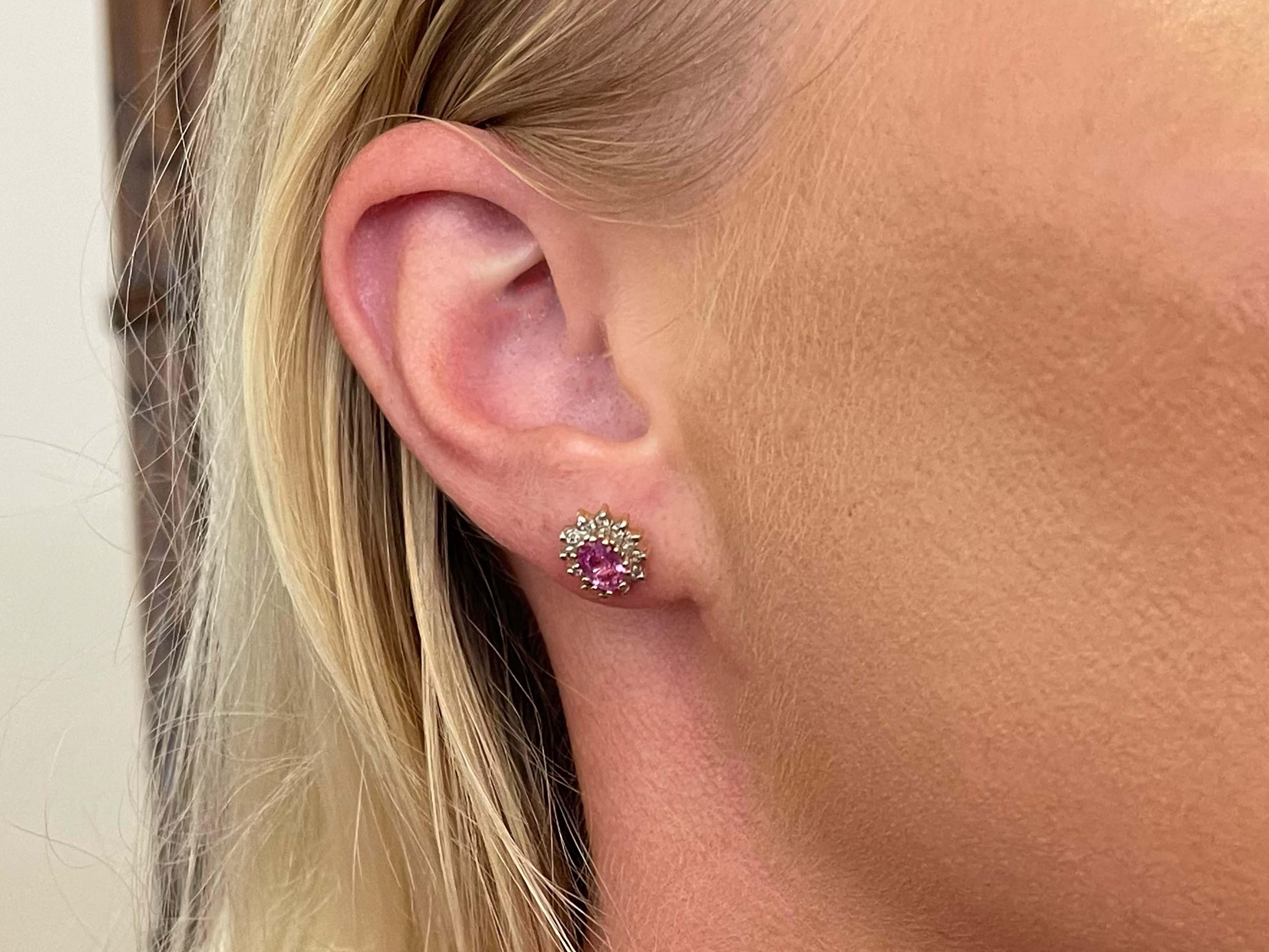 Earrings Specifications:

Metal: 14k Gold

Earring Length: 11 mm

Total Weight: 2.5 Grams

Gemstone: pink sapphire

Sapphire Carat Weight: ~1.20 carats

Diamonds: 24

Diamond Color: H-I

Diamond Clarity: VS2-SI1

Condition: Preowned

Stamped: