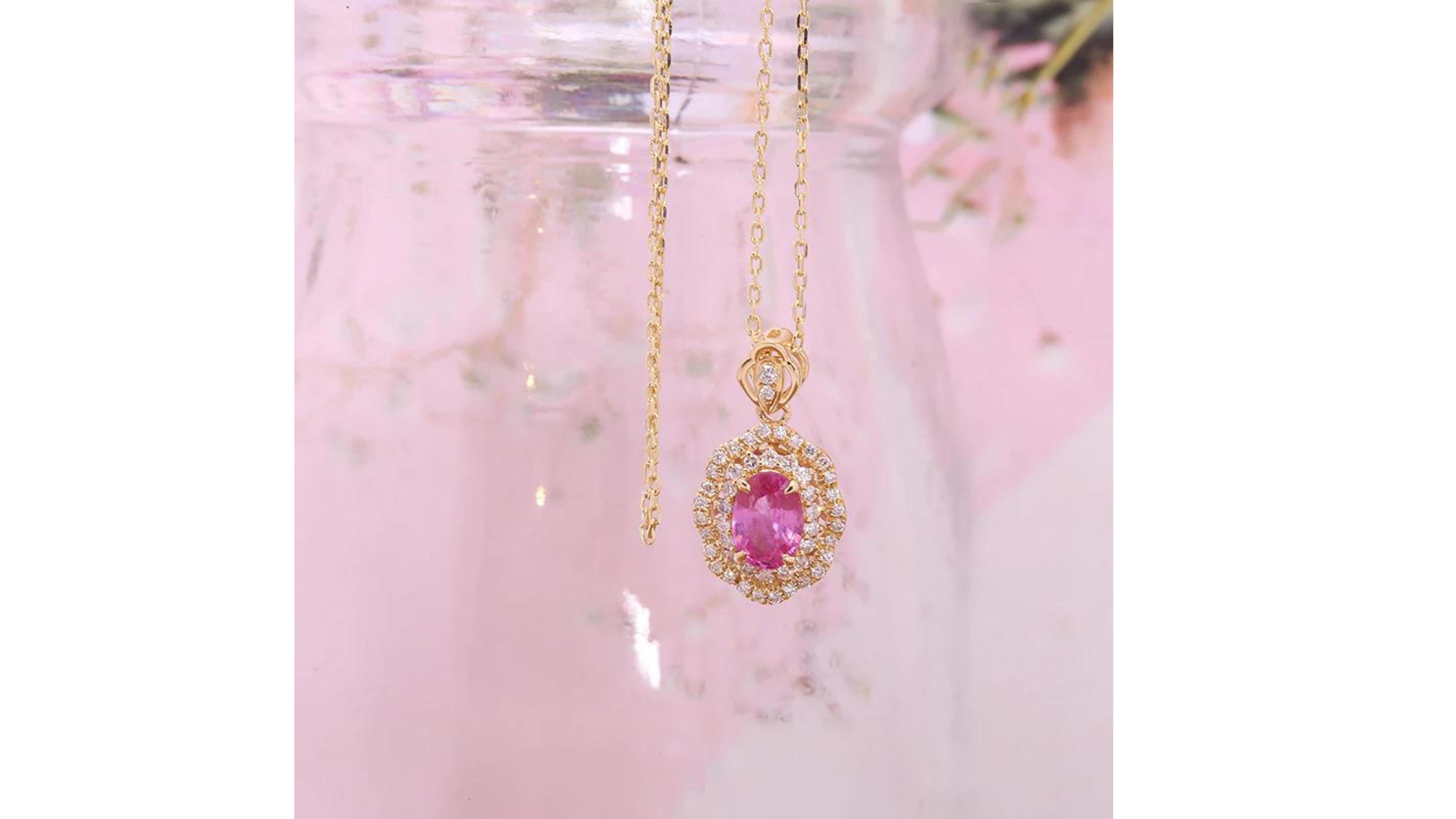 
Pink Sapphire Necklace 18 Karat Gold with 55 White Diamonds around the centre stones in 2 rows and on the bail too.   It can be in 9 and 14 Karat Gold too. 

Pink sapphires have been exponentially increasing in popularity as a modern and extremely