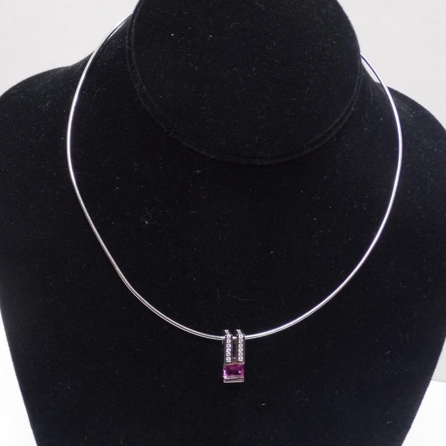 Breathtaking 14K white gold choker style necklace circa 1980s! Featuring the most beautiful charm compromised of a 1.5 carat emerald cut pink sapphire complimented by 18 round diamonds. This is such a stunning and classic piece, style this for an