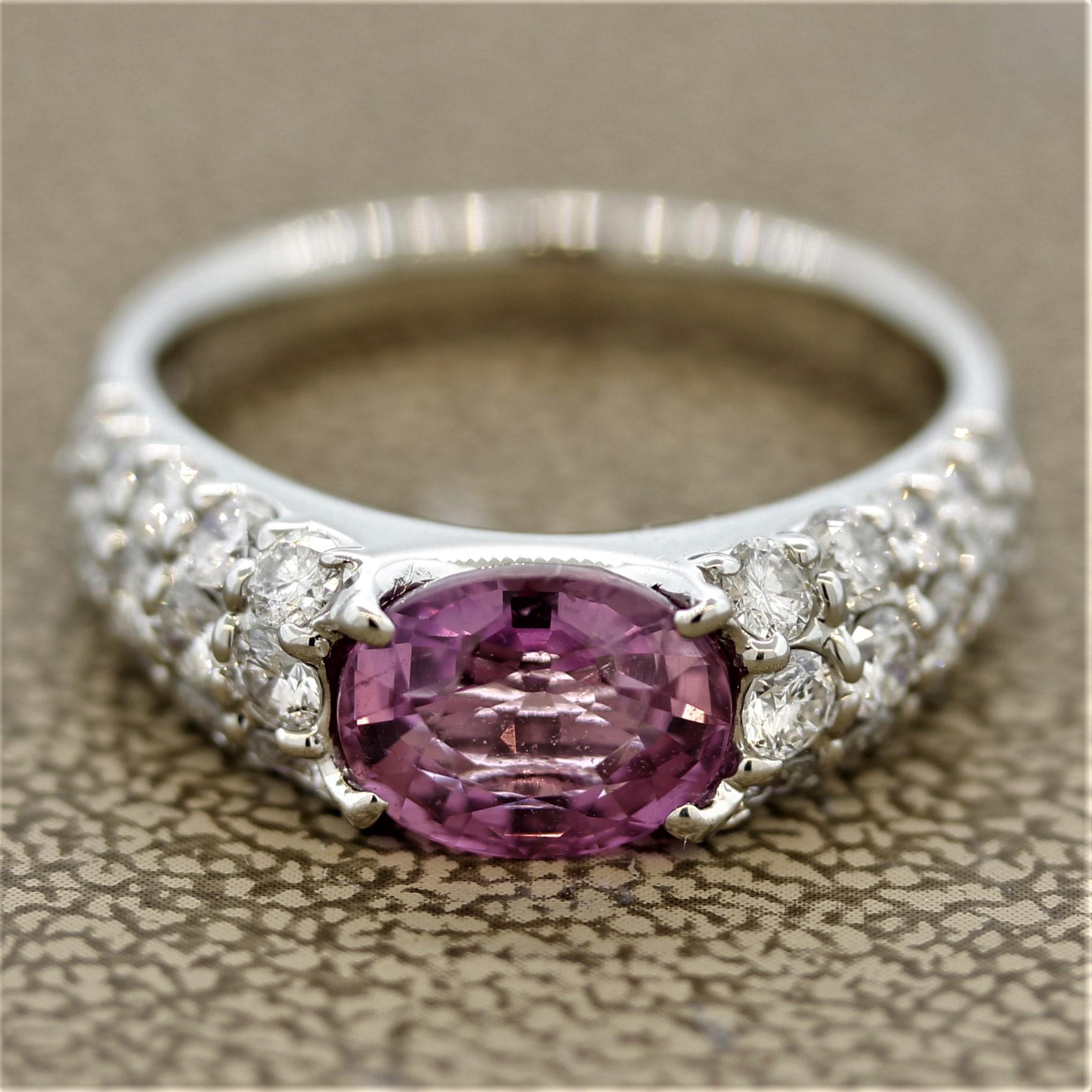 A superb pink sapphire ring! The sapphire is cut as an oval shape weighing 2.37 carats and has a pure bright pink color. It is accented by 1.15 carats of round brilliant cut diamonds set on the sides of the ring. Hand-fabricated in platinum.

Ring