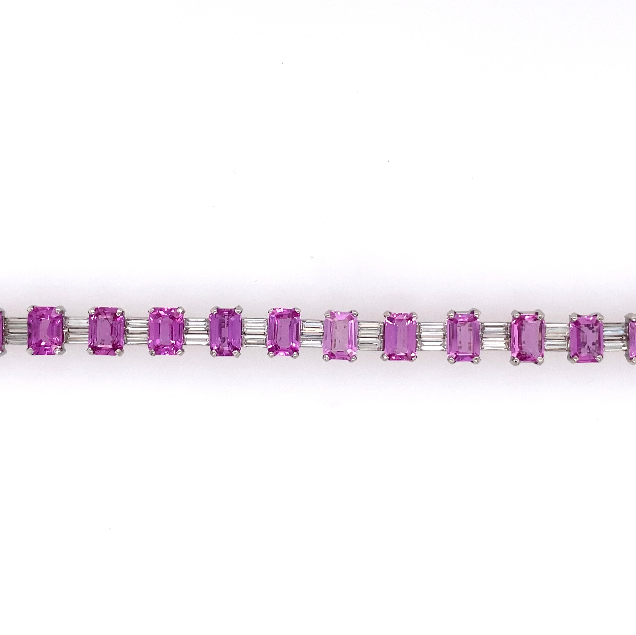 Composed of a row of alternating rectangular pink sapphires and perpendicularly set baguette-cut diamonds; estimated total diamond weight: 2.80 carats; mounted in platinum; length: 6 5/8 in.
