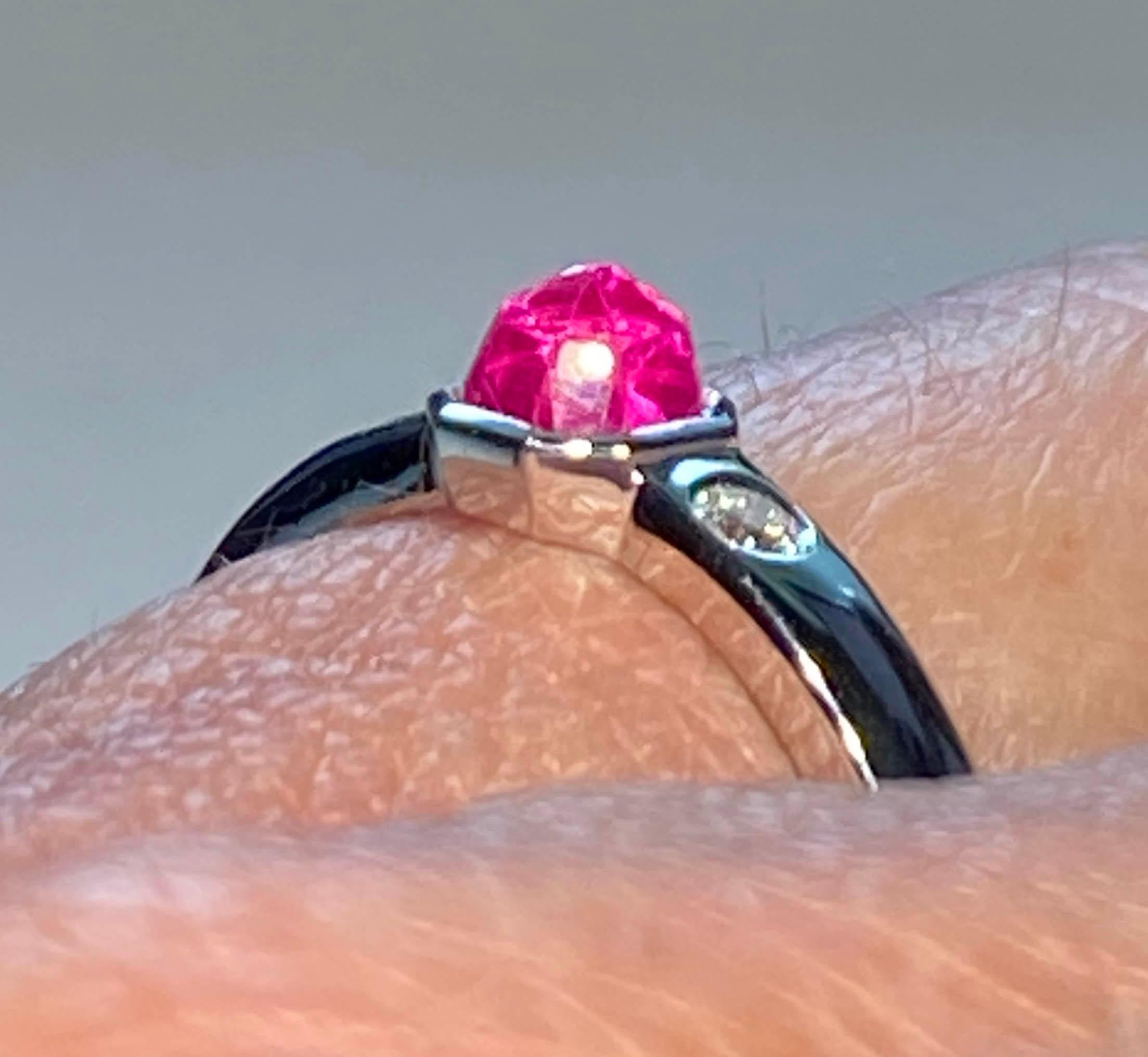 Kary Adam Designed, 18kt White Gold Ring, set with a Pavillion Up, Pink Sapphire and two accent Diamonds. Sapphire Weight is 0.74 Carats, Diamond Weight is 0.07 Carats. Gold Weight 3.39 Grams. Ring Size 7 USA

Originally from San Diego, California,