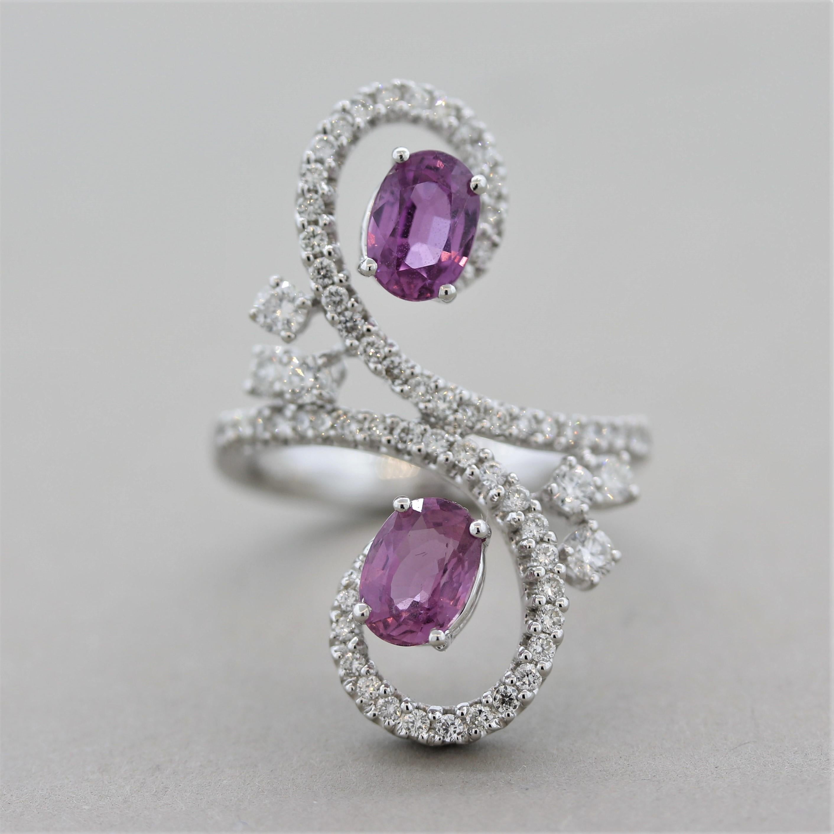 A unique and playful cocktail ring featuring 2 pink sapphires weighing 2.48 carats. They have a bright and vibrant color and are free of any eye-visible inclusions allowing the brilliance of the stones to shine. They are accented by 0.88 carats of