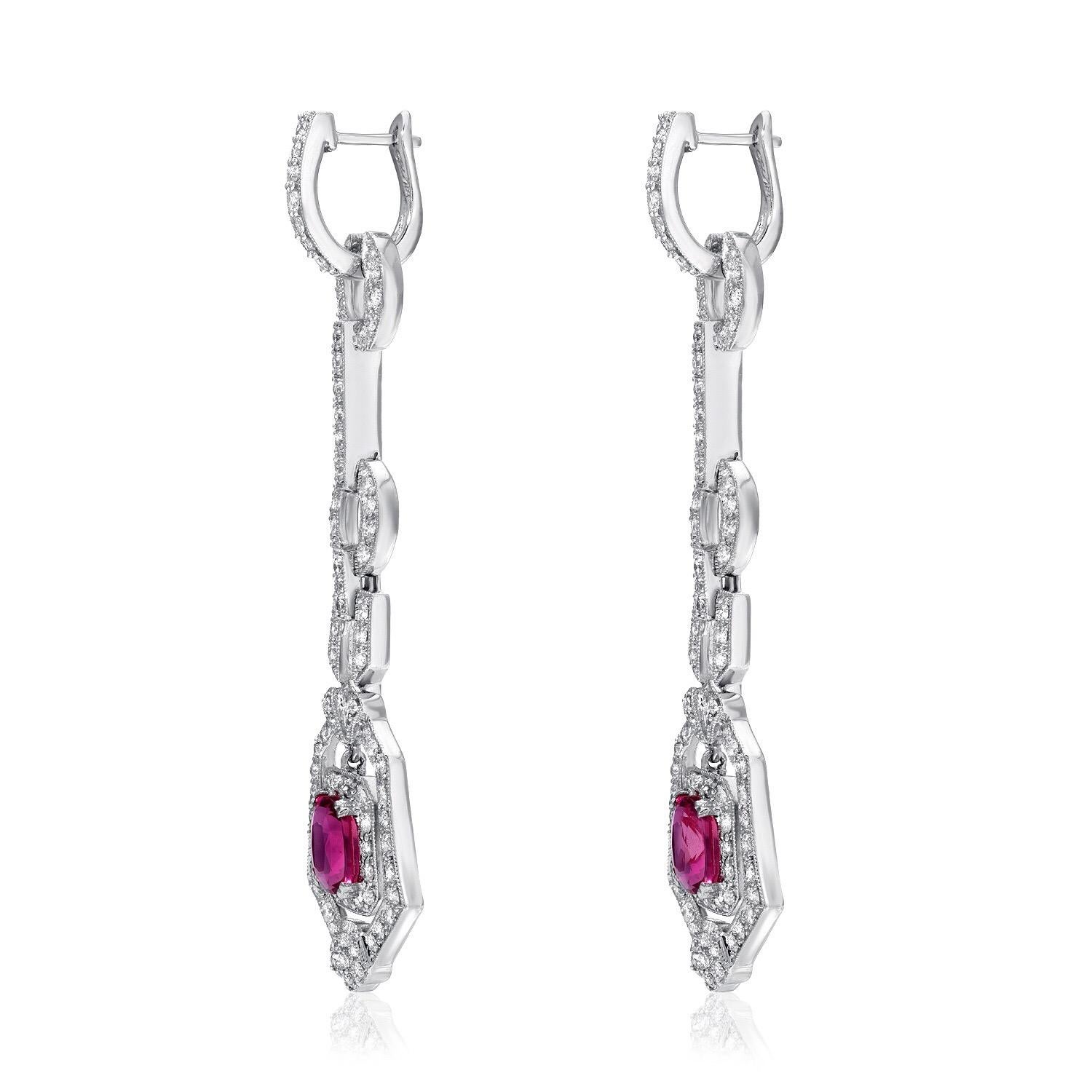 Pink Sapphire earrings displaying a pair of cushion cut Pink Sapphires weighing a total of 2.90 carats, accented by a total of 2.00 round diamonds, in 18K white gold. The lever back diamond set tops can be removed and worn separately as huggie hoop