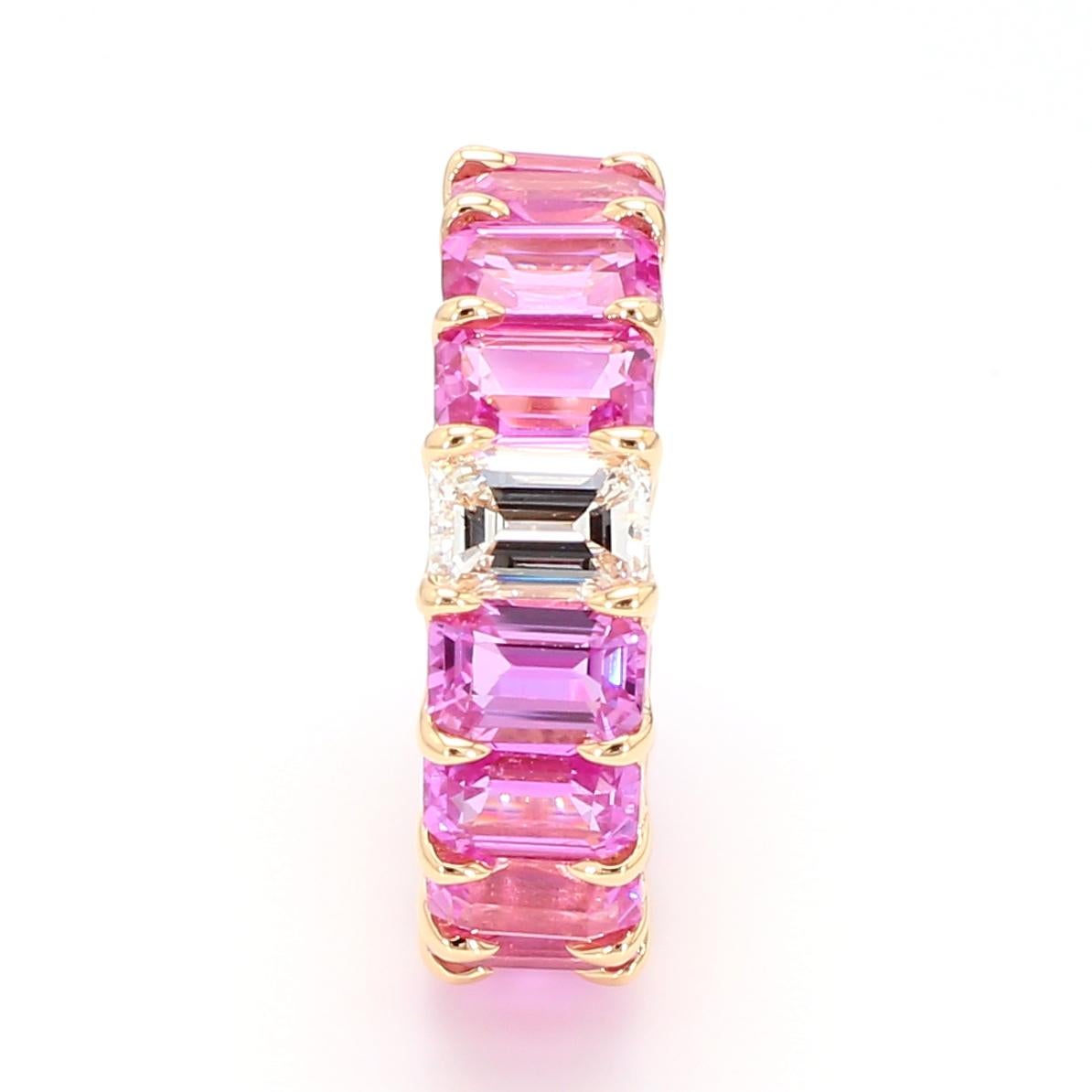 Beautiful and Forward Eternity Band.
Ring features 16 perfectly matched Pink Sapphires weighing 11.14 Carats and
1 Emerald Cut Diamond weighing 0.71 Carats.
Set in 18 Karat Rose Gold.
Size 6.
Can be worn Diamond Side up or down.